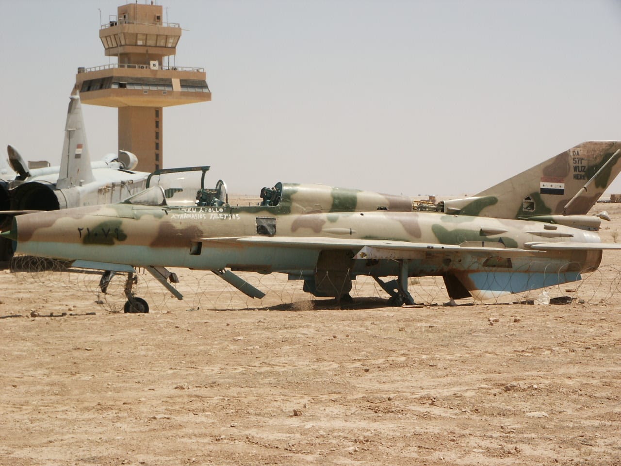 Abandoned Iraqi aircraft at Al Asad air base in western Iraq
Side view of Mig-21 and rear view of Mig-25 in the background.