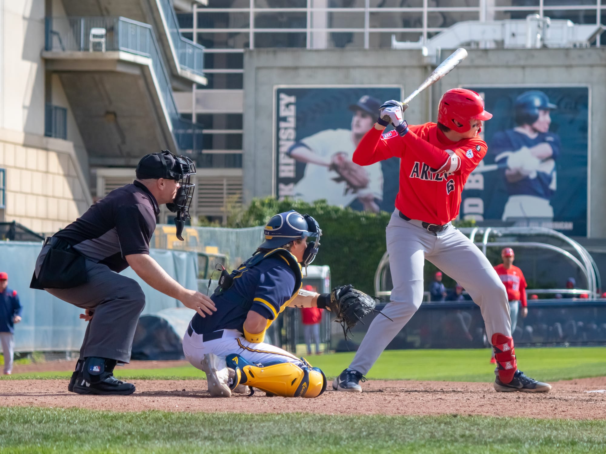 Daniel Susac, #6 Arizona, during an at bat in Arizona's 13-5 victory over California, March 13, 2022. Cole Elvis, #6 California, catching; Mike Fichter umpiring.