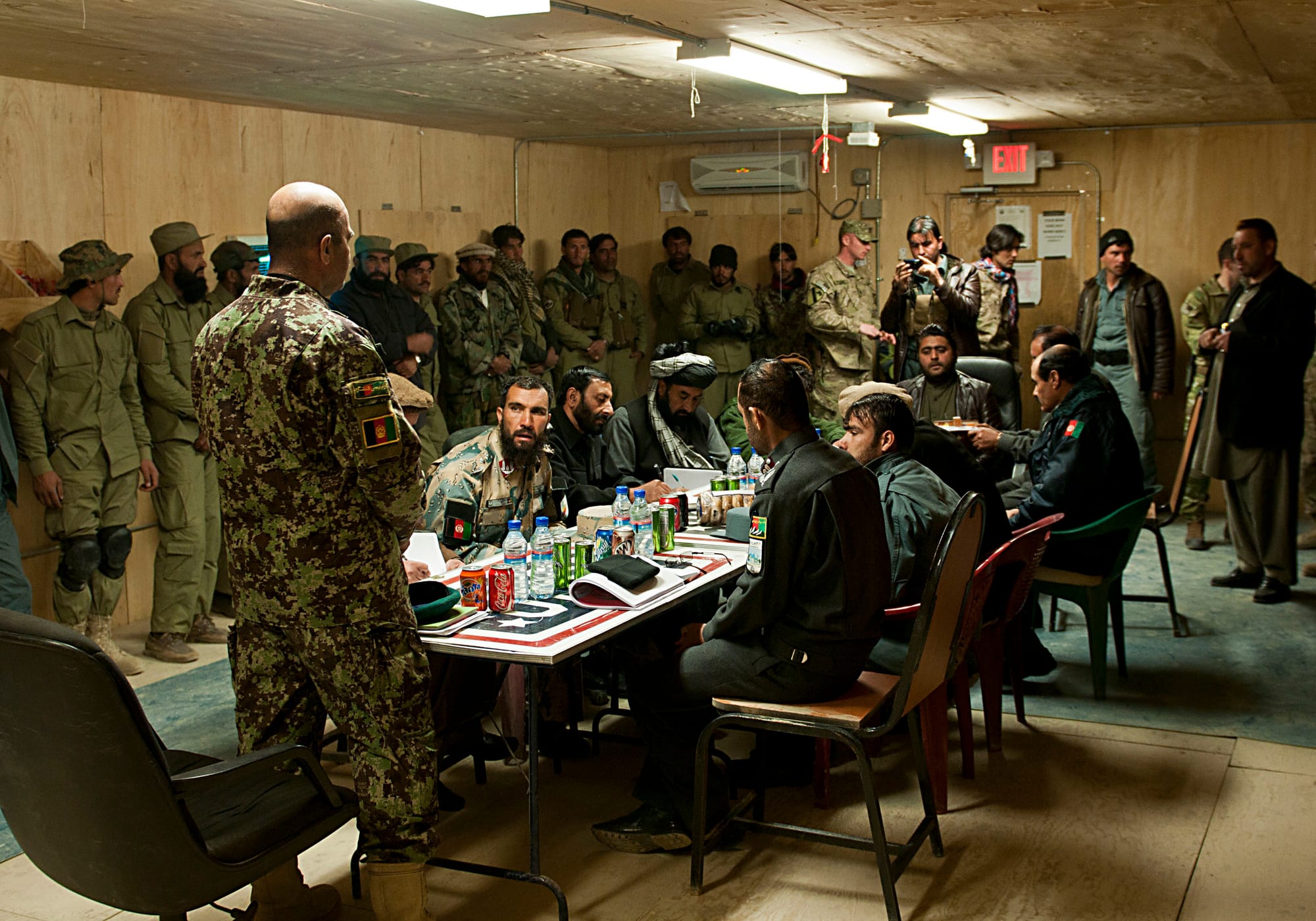 Officers with the Afghan Border Police and Afghan Uniformed Police crowd into a tiny room for a shura, Feb. 18, 2013, at Combat Outpost Chamkani. The shura was held to promote interagency cooperation and communication across district borders. (U.S. Army photo by Spc. Alex Kirk Amen, 115th Mobile Public Affairs Detachment)
Unit: 115th Mobile Public Affairs Detachment