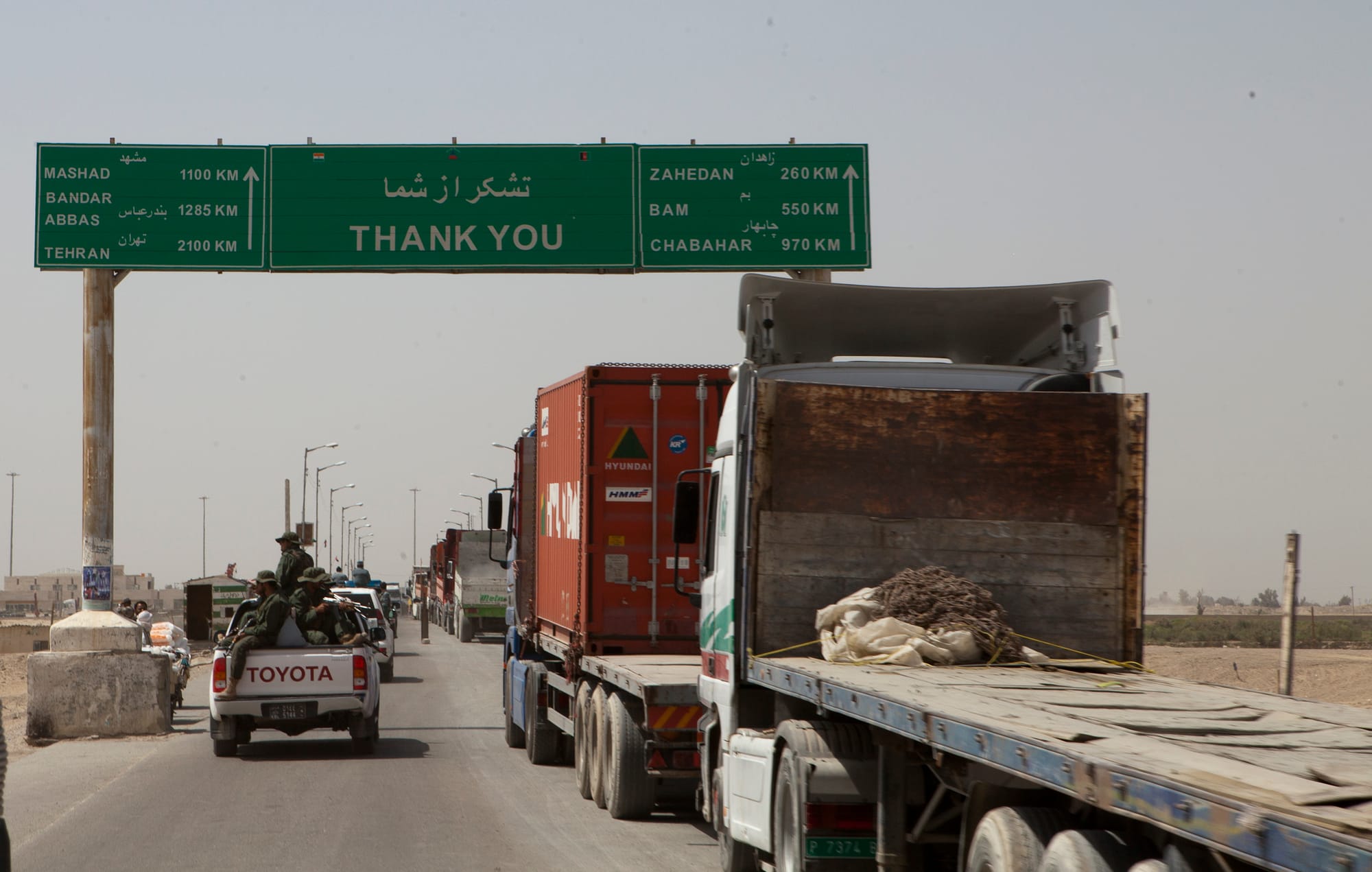 Trucks wait to cross the Afghanistan-Iran border in Zaranj, Afghanistan, May 10, 2011. The crossing is part of a busy trade route between Central Asia and the Middle East.