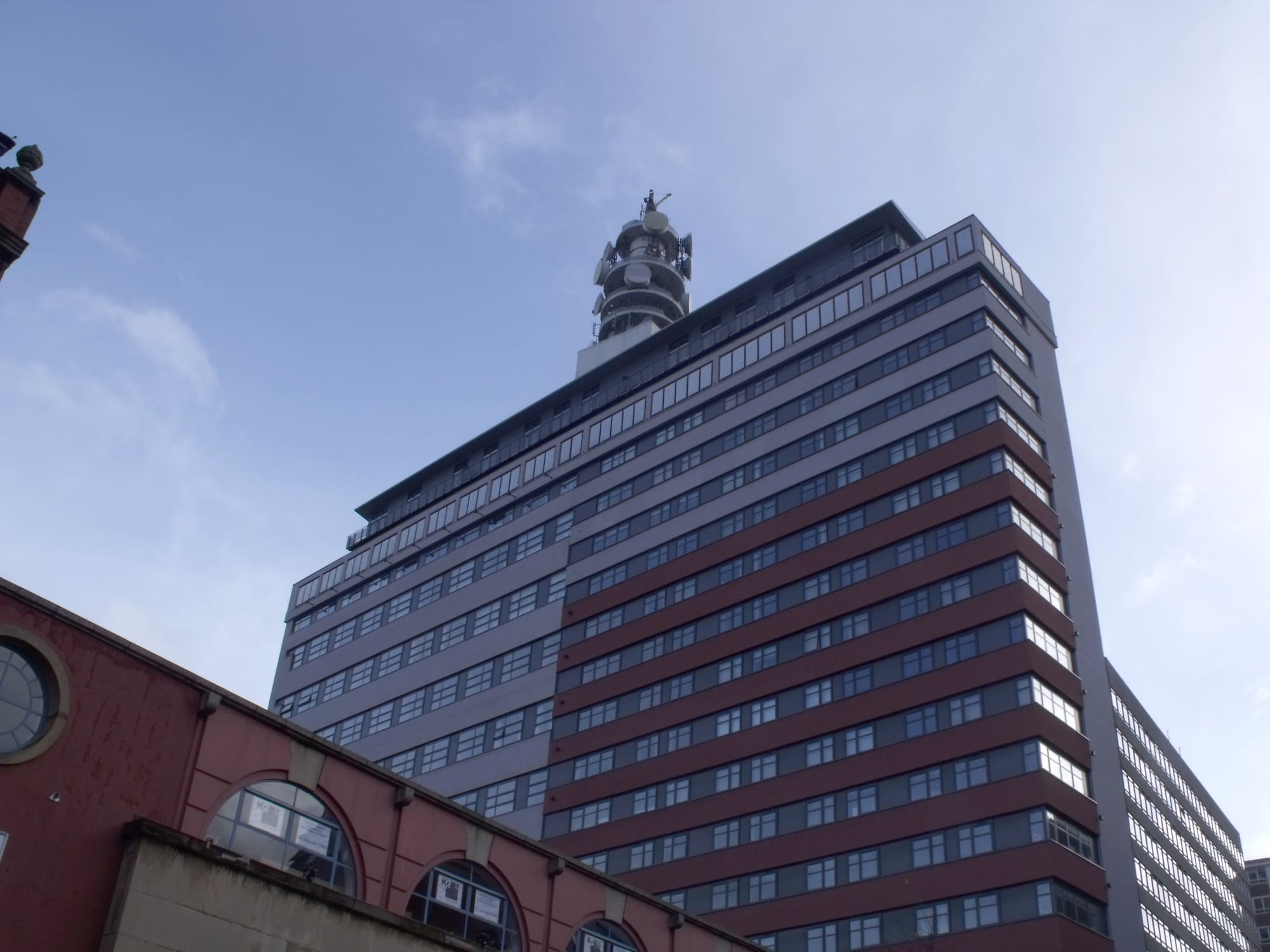 The BT Tower pops out above this new modern block of apartments. It is next door to the Assay Office on Newhall Street. Which is 133 - 137 Newhall Street, vacant offices to let.
From 2011 - the ex-telecom building now known as Brindley House now has apartments for sale. Prices start at £125,000 for one-bedroom apartment and £157,000 for two bedrooms. The selling agent is Arkade Property for luxury units inside the transformed 1970s property.

Details from the Birmingham Mail Extra - Homeseekers pullout, dated Thursday, 3rd February 2011.