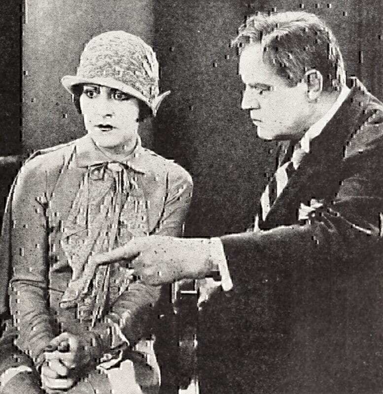 Still from the American comedy drama film Broken Hearts of Hollywood (1926) with Patsy Ruth Miller and Anders Randolf, from an advertisement in the front advertising section of the August 28, 1926 Motion Picture News.