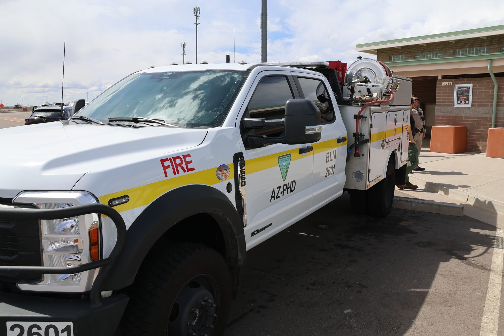 Bureau of Land Management Phoenix District fire program staff speak to the public at a wildfire prevention education outreach event at Sunset Point Rest Area, which is along the Interstate 17 in Arizona, on Friday, April 4, 2025. 
Photo by Chris Wonderly/Bureau of Land Management Arizona.