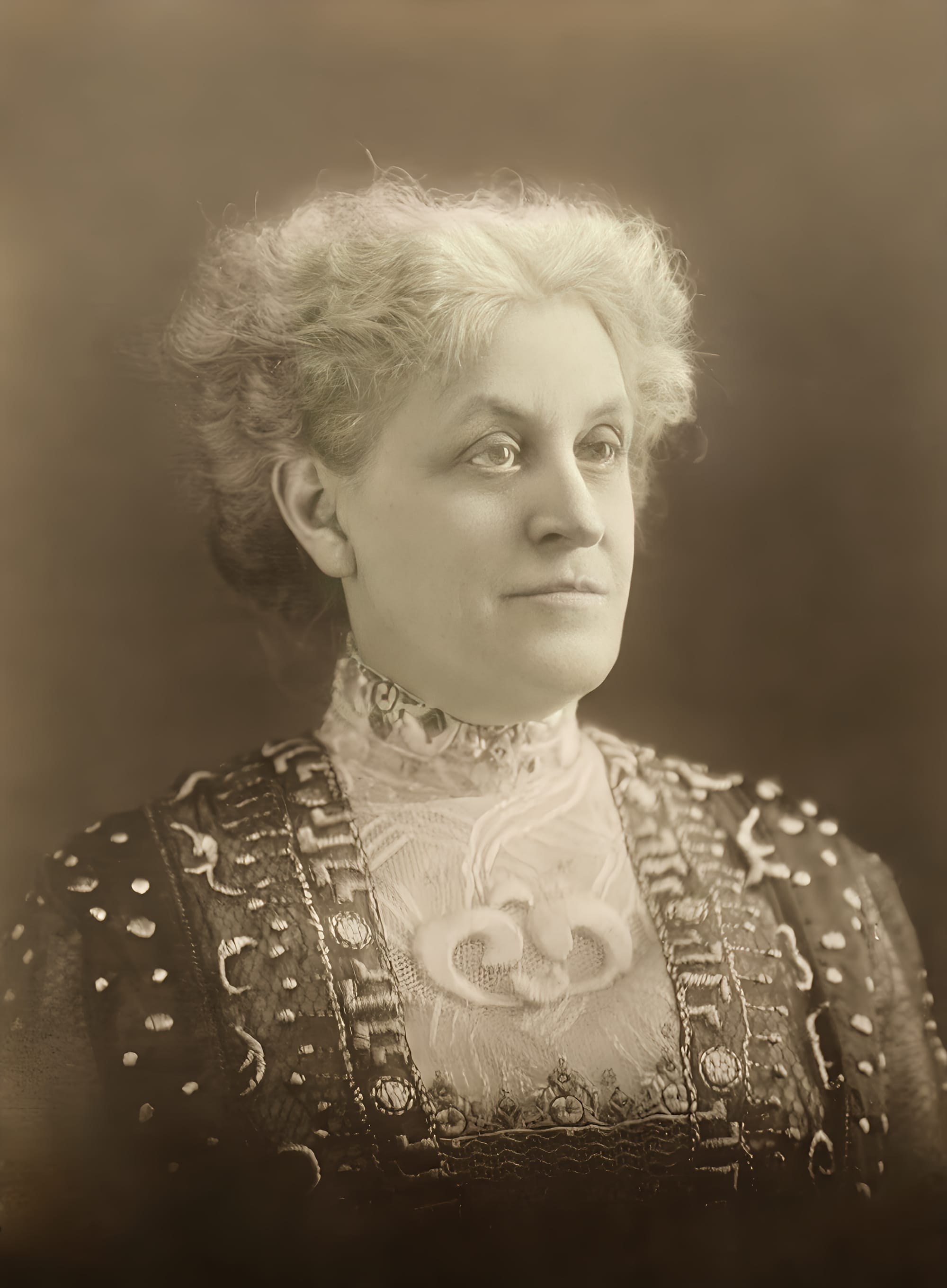 "Mrs. Carrie Chapman Catt, Speaker at Continental Hall." Verso is stamped "Joint Suffrage Procession Committee, 1420 F Street Northwest, Washington, D.C." See [1] for information about her speaking at Continental Hall. 

The original photograph was about 4x5.5" (10x14 cm). However, after cropping, the dimensions as seen are about 4x5" (10x13cm).[1]
