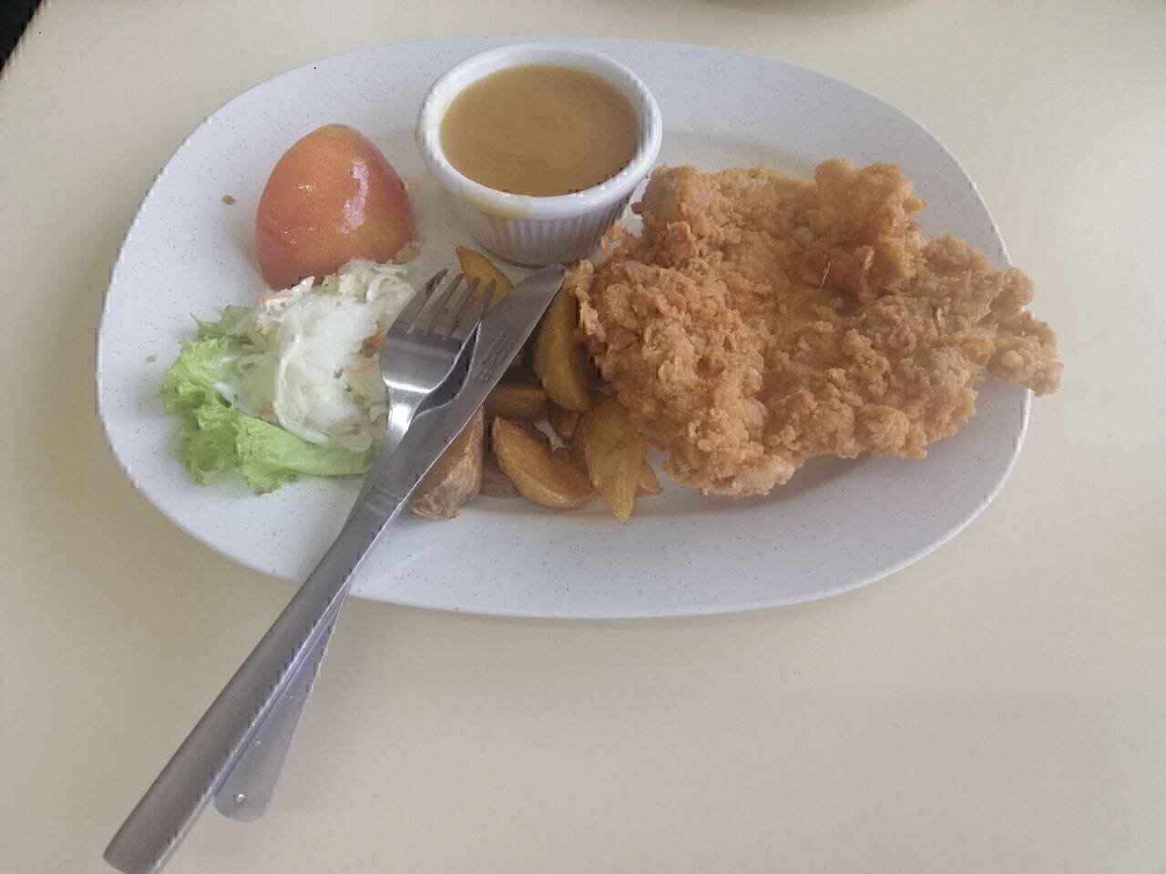 Chicken chop was created by Hainanese who migrated to Malaysia in the 19th century.Chinese ethnicities such as Hokkien,Teochew dominated more lucrative industries in Malaya, such as trade, agriculture, and mining, thus the Hainanese ended up becoming chefs and staff at hotels, restaurants, and bakeries or domestic servants for wealthy European and Peranakan families.As such circumstances,the Hainanese became adept at Western cooking techniques.When rent prices crashed during the Great Depression after World War II﻿, many took the opportunity to open kopitiams.These owners created fusion dish such as the chicken chop