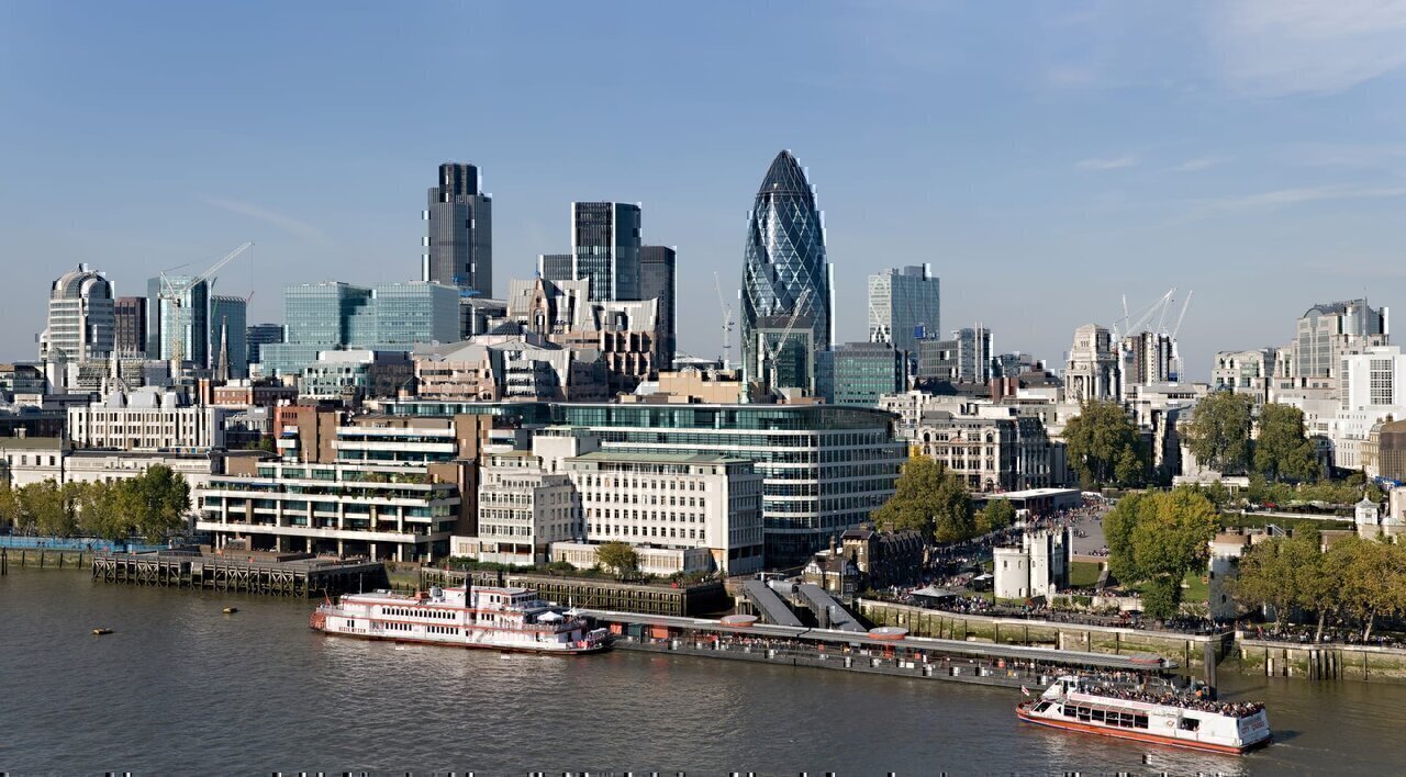 The City of London skyline as viewed toward the north-west from the top floor viewing platform of London City Hall on the southern side of the Thames. In the foreground: Dixie Queen and Millennium Time at Tower Millennium Pier. This is a 5 segment panoramic image taken by myself with a Canon 5D and 24-105mm f/4L IS lens.
