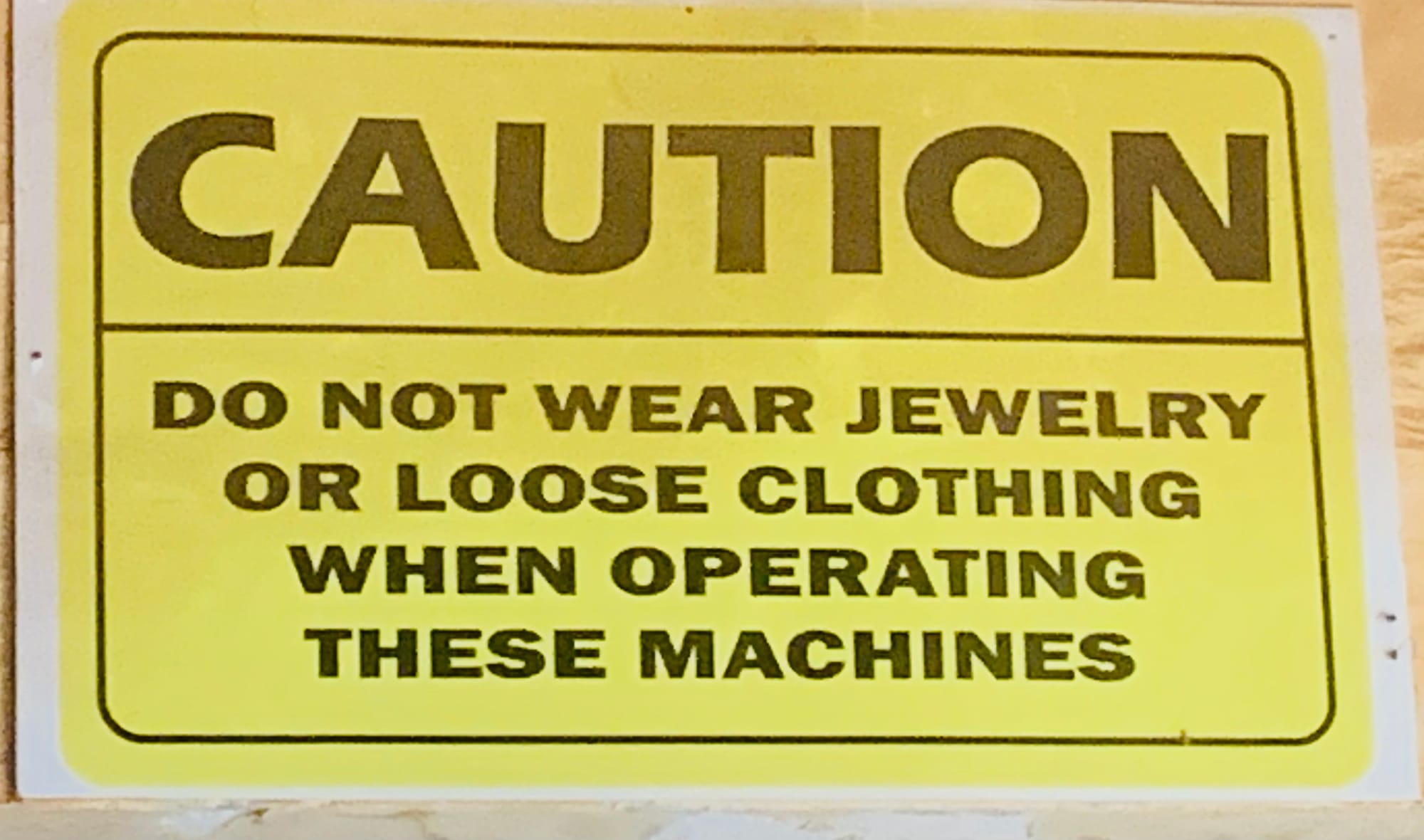 This is a safety level to prevent the wearying of in appropriate dress and jewellery pasted at the Wood Technology Department of Tamale Technical University