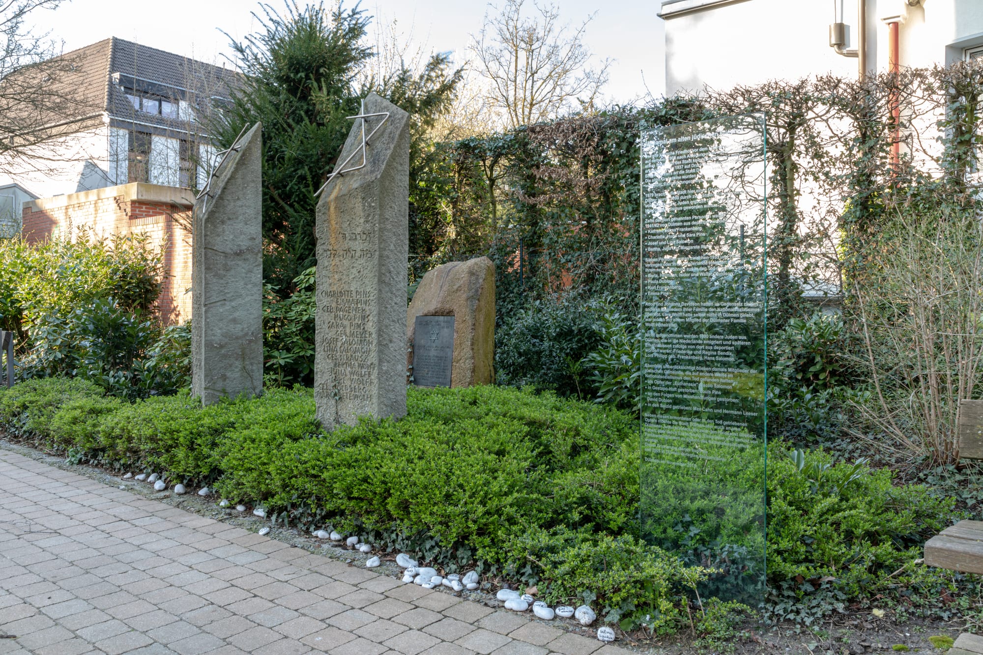 Memorial at the old jewish cemetery, Dülmen, North Rhine-Westphalia, GermanyIn Dülmen, the old Jewish cemetery was located at Lüdinghausen Gate&nbsp;– a burial site that had been used by Jewish community members since the early 17th century and existed until 1937. The dead of the Jewish community were buried there before a new cemetery was later established on Kapellenweg.In 1937, under pressure from the National Socialists and against the will of the Jewish community, the old cemetery was closed and the land sold. The gravestones of those buried there were moved to the then newer Jewish cemetery on Kapellenweg, but no exhumations took place within the tight deadline.After the cemetery was leveled, the vacated area was given the name Hindenburgplatz, named after the former Reich President Paul von Hindenburg. This square was created directly on the site of the former burial ground. Parts of the graves that had not yet been removed were covered; the local NSDAP used a swastika flower bed to plant the square, which symbolically represented the desecration of a sacred place.After the end of World War II, the name Hindenburgplatz was no longer officially used. The former cemetery area was later built over or used as green space, and it was not until decades later that people began to remember its former use and the Jewish community.Today, a memorial at the site of the old cemetery, the former Jewish cemetery outside the Lüdinghausen Gate gate, commemorates the Jewish citizens of Dülmen and their history.