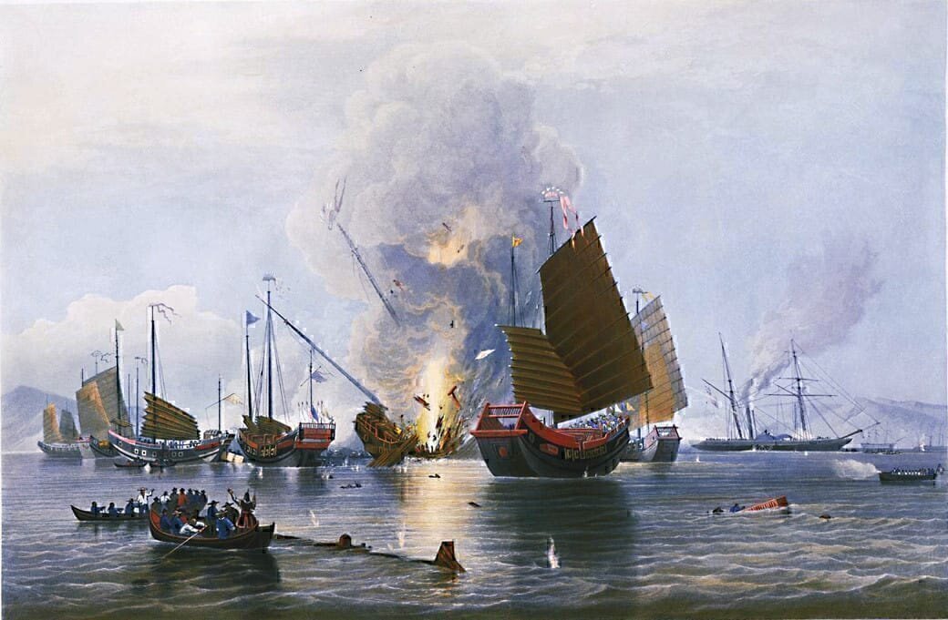 The East India Company iron steam ship Nemesis, commanded by Lieutenant W. H. Hall, with boats from the Sulphur, Calliope, Larne and Starling, destroying the Chinese war junks in Anson's Bay, on 7 January 1841.
An engagement in the First Opium War (1839-42), showing the ‘Nemesis’ (right background, in starboard broadside view) attacking a fleet of Chinese war junks in the middle ground. The war junk third from the left is shown being destroyed with splinters flying up into the air. Two rowing boats with Chinese passengers ew from the left foreground. Various men can be seen overboard and clinging on to debris throughout the scene. The lettering below includes lists of dimensions. PAH8193 and PAH8893 are additional copies, both hand-coloured, and the print is from an oil painting by Duncan presented to the Williamson Art Gallery at Birkenhead in 1925, with another showing Prince Albert visiting iron ships off Woolwich Dockyard. They were a gift from Alderman J.W.P. Laird, one of the Birkenhead shipbuilding family who built the 'Nemesis' and others of the vessels shown in them. On 7 January 1841, the 'Nemesis' of the Bombay Marine (the East India Company's naval service), commanded by William Hutcheon Hall, with boats from the ‘Sulphur’, ‘Calliope’, ‘Larne’ and ‘Starling’, destroyed Chinese war junks in Anson's Bay, Chuenpee, near the Bocca Tigris forts guarding the mouth of the Pearl River up to Canton. British forces then captured the forts themselves. Hall was a Royal Naval master at the time. He had steam experience and had been privately engaged by John Laird to command the 'Nemesis', which the latter had built experimentally as the first fully iron warship, and was so successful in it in China that in 1841 he was specially commissioned as a Naval lieutenant. He went on to later Royal Naval service as a captain in the Crimean War and was a retired admiral at his death in 1875. His portrait (BHC2733) and papers are also in the Museum collection.