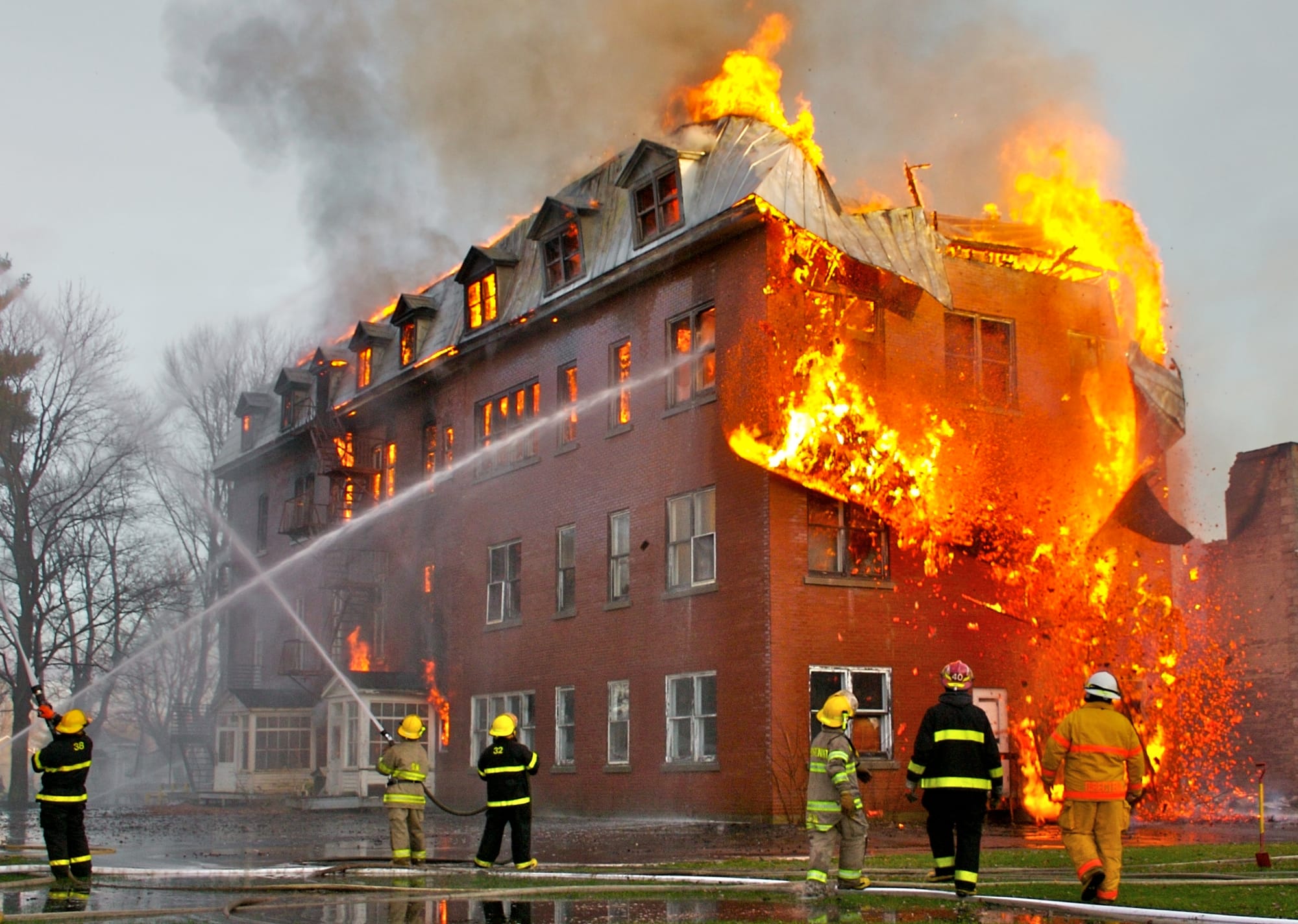 A photograph of a major fire.
This photograph was taken during a major fire involving an abandoned convent in Massueville, Quebec, Canada. The fire was so violent that firefighters had to focus their efforts on saving the adjacent church instead of attacking the involved building. This photograph is a good example of what can be done with specialized fire photography, as the public did not have access to this extraordinary point of view and it was necessary to have fire photographer credentials to take pictures from there.
