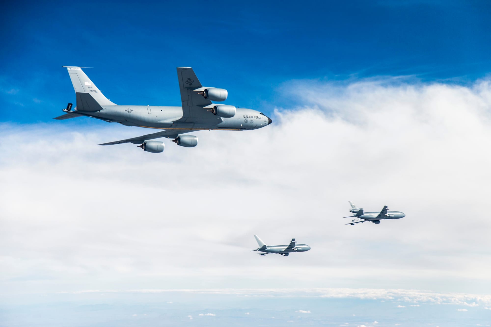 Photos of Boeing's KC-46A, center, conducting tests of aircraft acceleration and vibration exposure while flying  in receiver formation at various speeds and altitudes behind either the KC-10 Extender or the KC-135 Stratotanker. Testing for this phase was coordinated from Edwards Air Force Base, Calif., and conducted above Owens Valley and parts of the western Mojave Desert.
Unit: 92d Air Refueling Wing