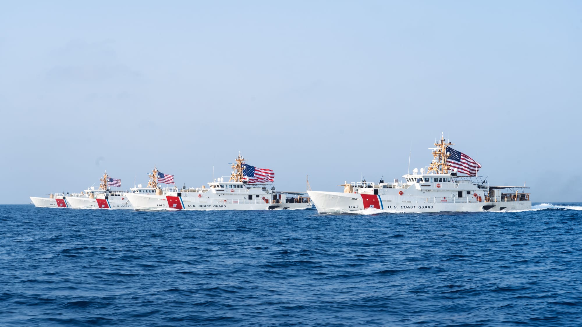 220822-A-KS490-1182 STRAIT OF HORMUZ (Aug. 22, 2022) From the left, U.S. Coast Guard fast response cutters USCGC Glen Harris (WPC 1144), USCGC John Scheuerman (WPC 1146), USCGC Emlen Tunnell (WPC 1145) and USCGC Clarence Sutphin Jr. (WPC 1147) transit the Strait of Hormuz, Aug. 22. The cutters are forward-deployed to U.S. 5th Fleet to help ensure maritime security and stability across the Middle East.