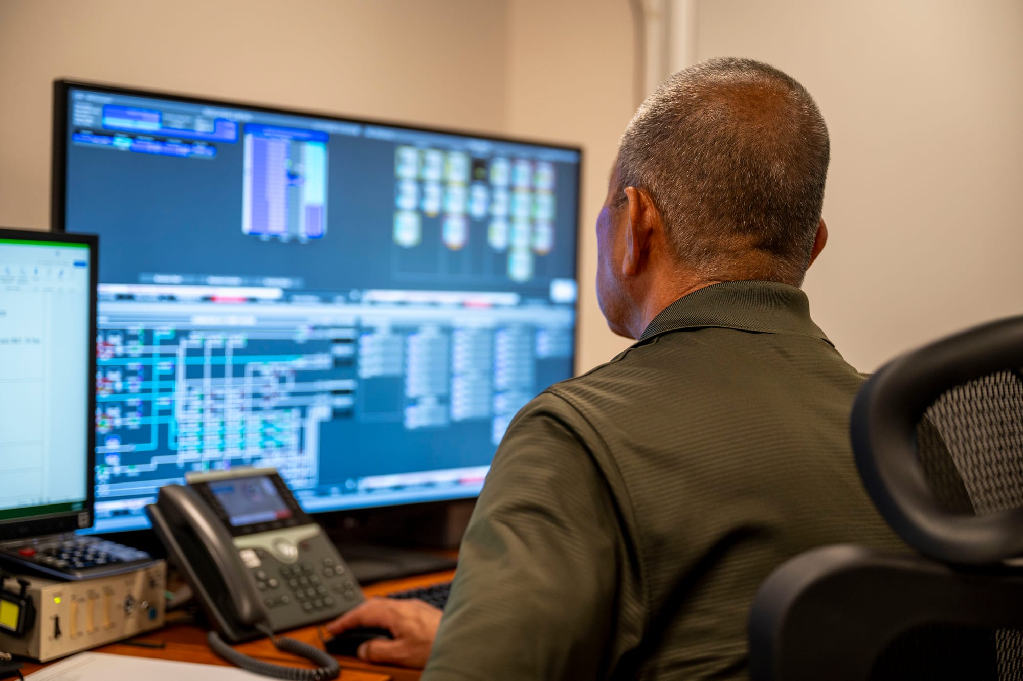 Toshihide Smimoji, Defense Logistics Agency Energy Okinawa control room foreman, monitors fuel lines and levels near Kadena Air Base, Japan, July 2, 2025. The DLA Energy Okinawa team handles every part of fuel operations: coordinating deliveries, conducting lab testing, managing storage and inventory, and overseeing distribution. (U.S. Air Force photo by Senior Airman James Johnson)