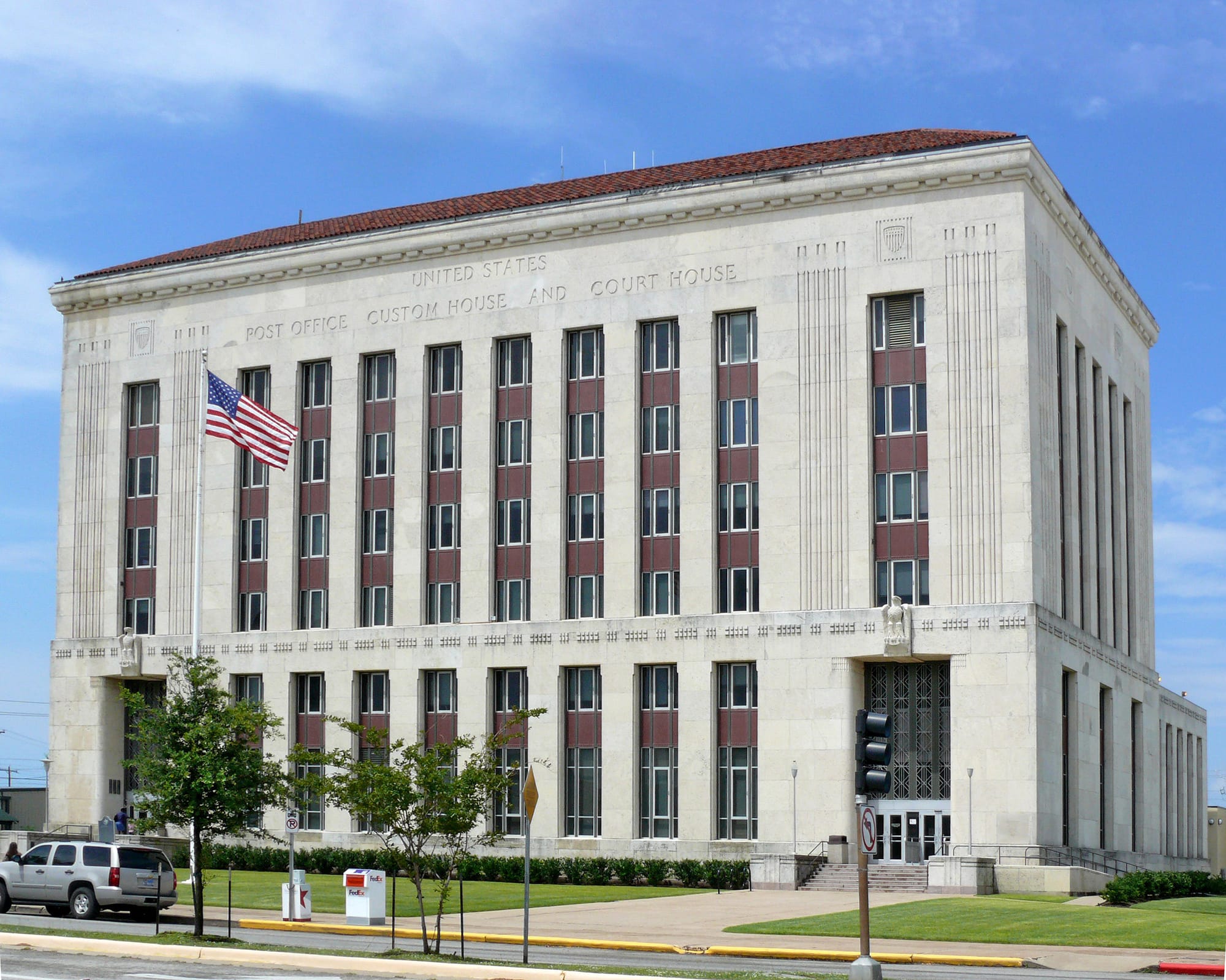 The inscription on the building says, "Galveston US Post Office, Custom House and Courthouse."  In front of the building a historical marker reads:
"First weather service office in Texas, and one of first in the United States; established April 19, 1871, slightly over a year after Congress passed an act in Feb. 1870 creating the Public Weather Service of the United States under the Army Signal Corps.
For a century the Galveston service has issued Gulf storm forecasts. It correctly posted warnings prior to Texas' greatest natural disaster -- the 1900 hurricane that left more than 6,000 dead -- but had its own office demolished (although records were saved). Its men shared the common sorrows of the city in losses of family members and property.
In Sept. 1961 the first live and direct televised picture of a hurricane—the famous and devastating Carla—was broadcast from the Galveston station. This set a pattern for other radar-equipped coastal weather stations throughout the United States.

Galveston is the only weather station directly on the Gulf Coast west of Florida. Although many meteorological stations have moved with the coming of the aviation age, this oldest Texas station has compiled charts for 100 years within a 5-block area."