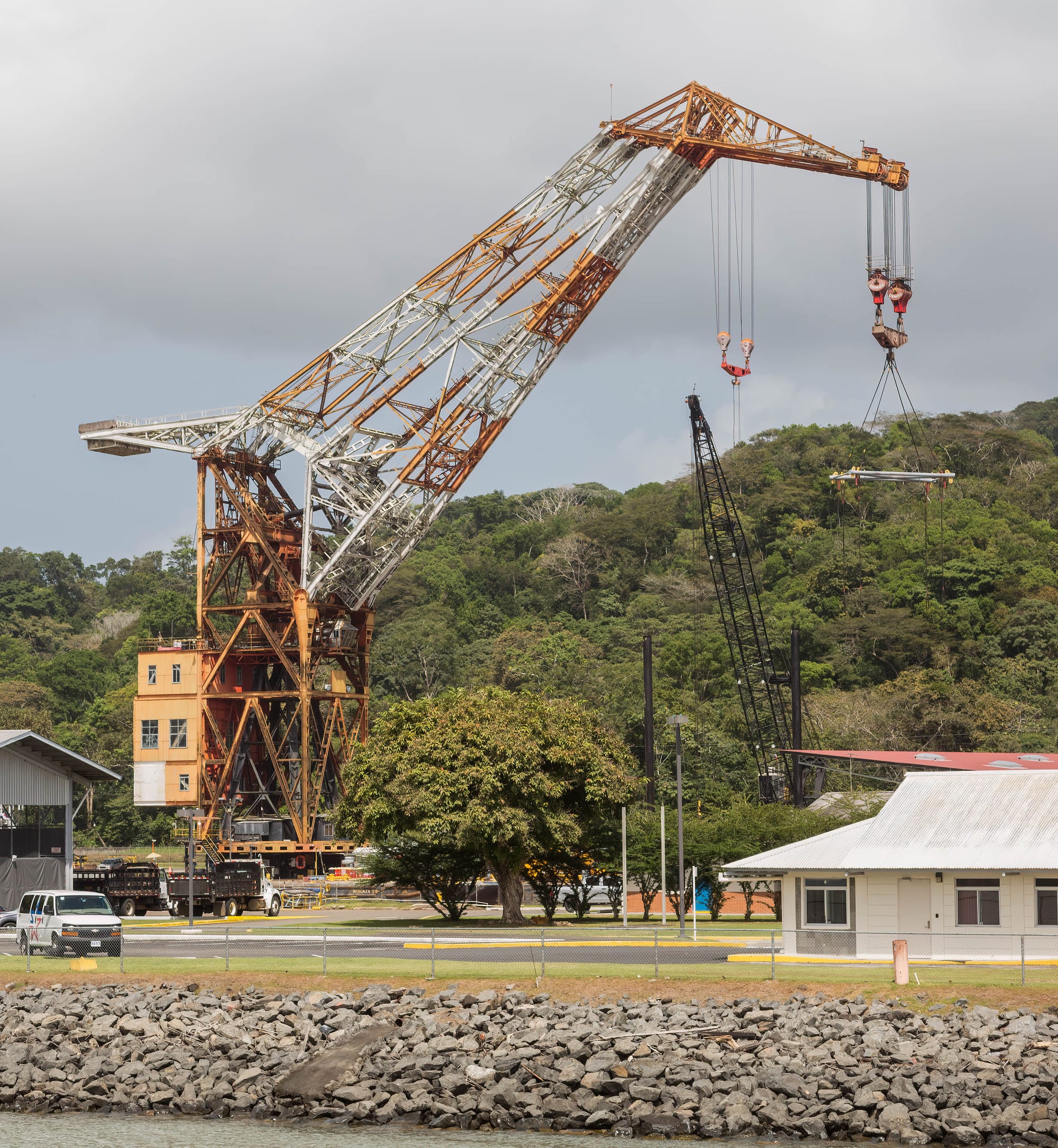 Heavy-duty floating crane serving the Panama Canal authority.  It weighs 5,000 tons, is 374 feet high, and can lift 350 tons.  The crane was built in Germany in 1941 and siezed by the US after the war.  It then served at the Long Beach Naval Shipyard until it was transferred to the Canal in 1996.  You can't see from this angle, but it is actually floating on an inlet of the Chagres River along the Canal route.
Because of its history, it is also named "Herman the German".