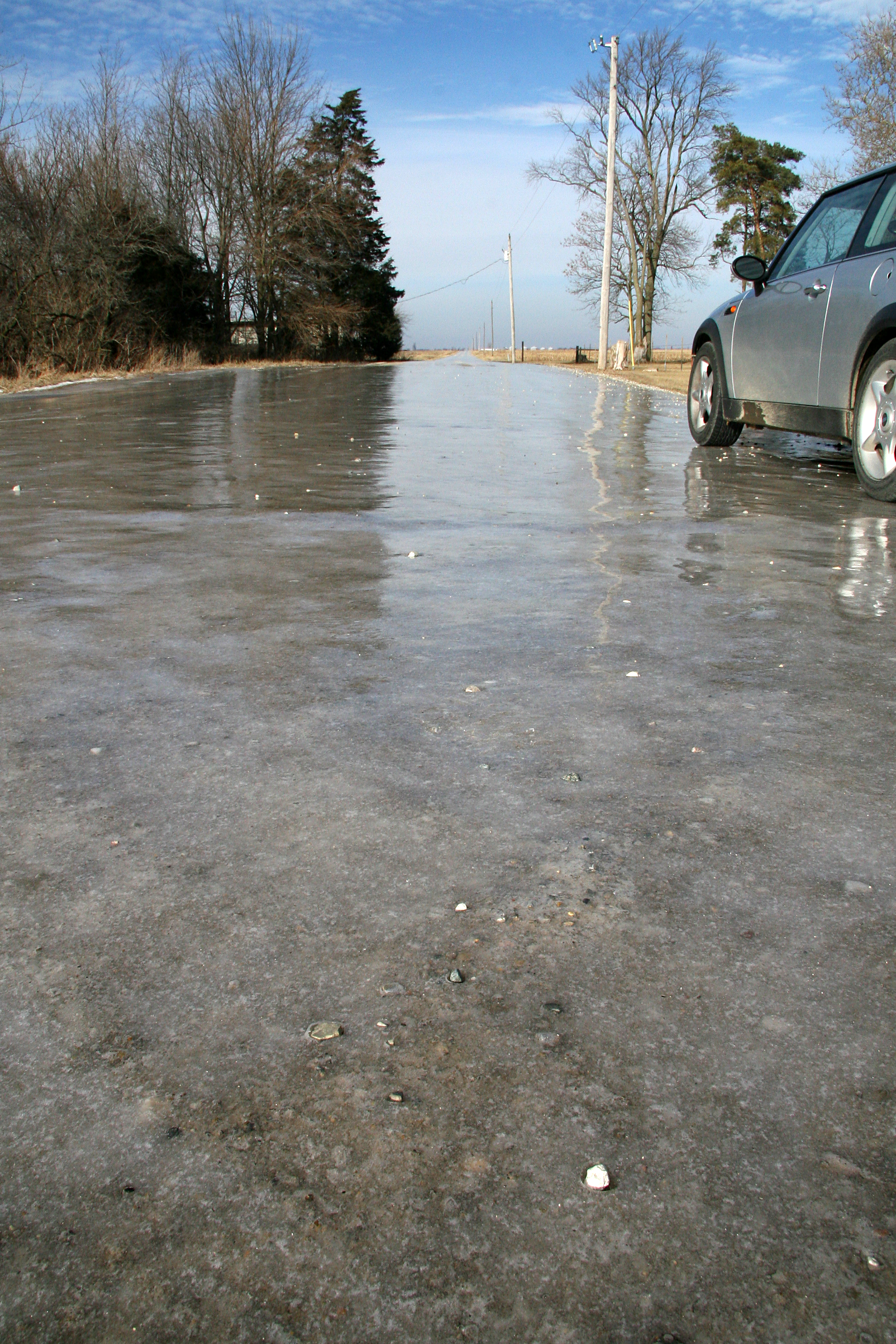 An ice-covered gravel road in rural Warren County, Indiana.  Photo looks north from the intersection of county roads 800 West and 300 North at Stewart.