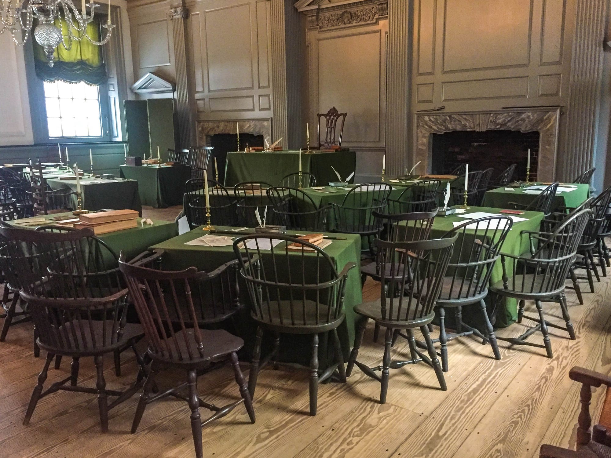 Meeting room with lines of tables and chairs covered with green table cloths, candles, books, papers, and quill pens
Independence Hall Assembly Room
Keywords: Independence National Historical Park; Independence; INDE; Pennsylvania; Continental Congress; Constitution
