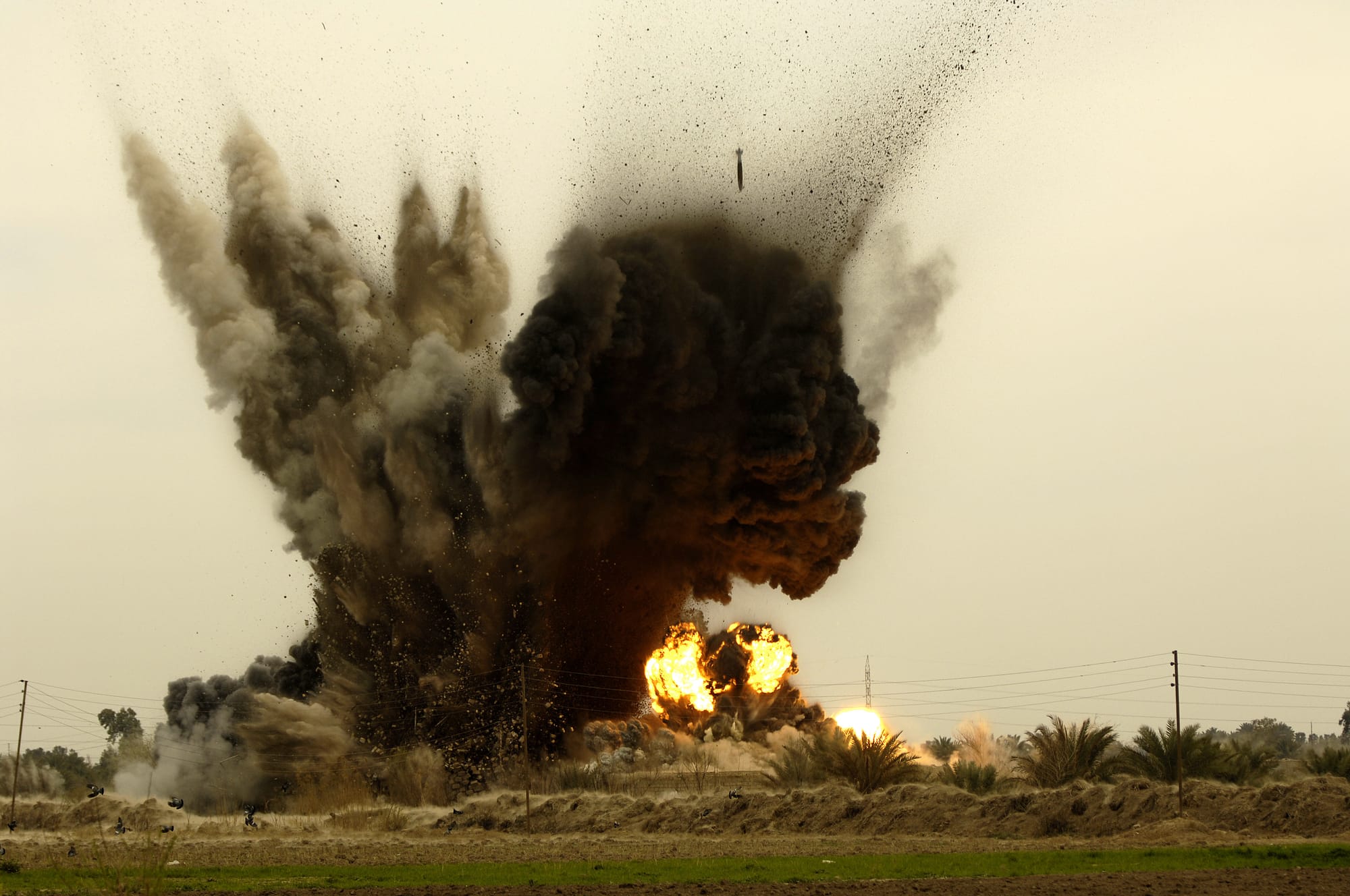 Six GBU-38 munitions are dropped by a B-1B Lancer aircraft onto an insurgent torture house and prison in Northern Zambraniyah, Iraq, March 10, 2008. The munitions drop was cleared by U.S. Air Force Senior Airman Joseph Aton, a joint terminal attack controller from Fort Hood Texas, and deployed with the 2nd Brigade Combat Team, 3rd Infantry Division. (U.S. Air Force photo by Master Sgt. Andy Dunaway) (www.army.mil)