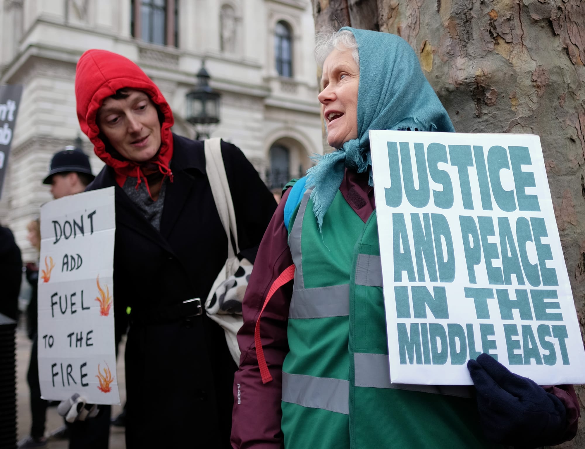 Two of the protesters who came to London today for the "Don't Bomb Syria" demo had traveled a long distance.  I think the woman on the right said she had come all the way from Scarborough.  She's chatting with another activist close to Downing Street.
Hundreds of demonstrators gathered in Whitehall to protest the government's determination to press ahead with air strikes on Syria.
Some protesters told me they feared that bombing Syria would only create more casualties which in turn would only help IS gain more local and international recruits to its' cause.  
There was also anger that at a time of unprecedented welfare cuts, Cameron was embarking the U.K. on action that would be highly costly to taxpayers even if also highly profitable to Britain's arms industry.  
A poll in this morning's Daily Mirror suggested the U.K's population is divided and without a convincing popular mandate for David' Cameron's plan to bomb IS positions in Syria.  
According to the paper:
"48% back British air raids on the extremists, contrasted with 30% who want the RAF to stay out of the fight, and 21% who don’t know. But an overwhelming majority - 59% believe sending Tornado warplanes into action over Syria will increase the risk of terrorists inflicting carnage in the UK."

If you need to contact me for any reason please email alisdare@gmail.com