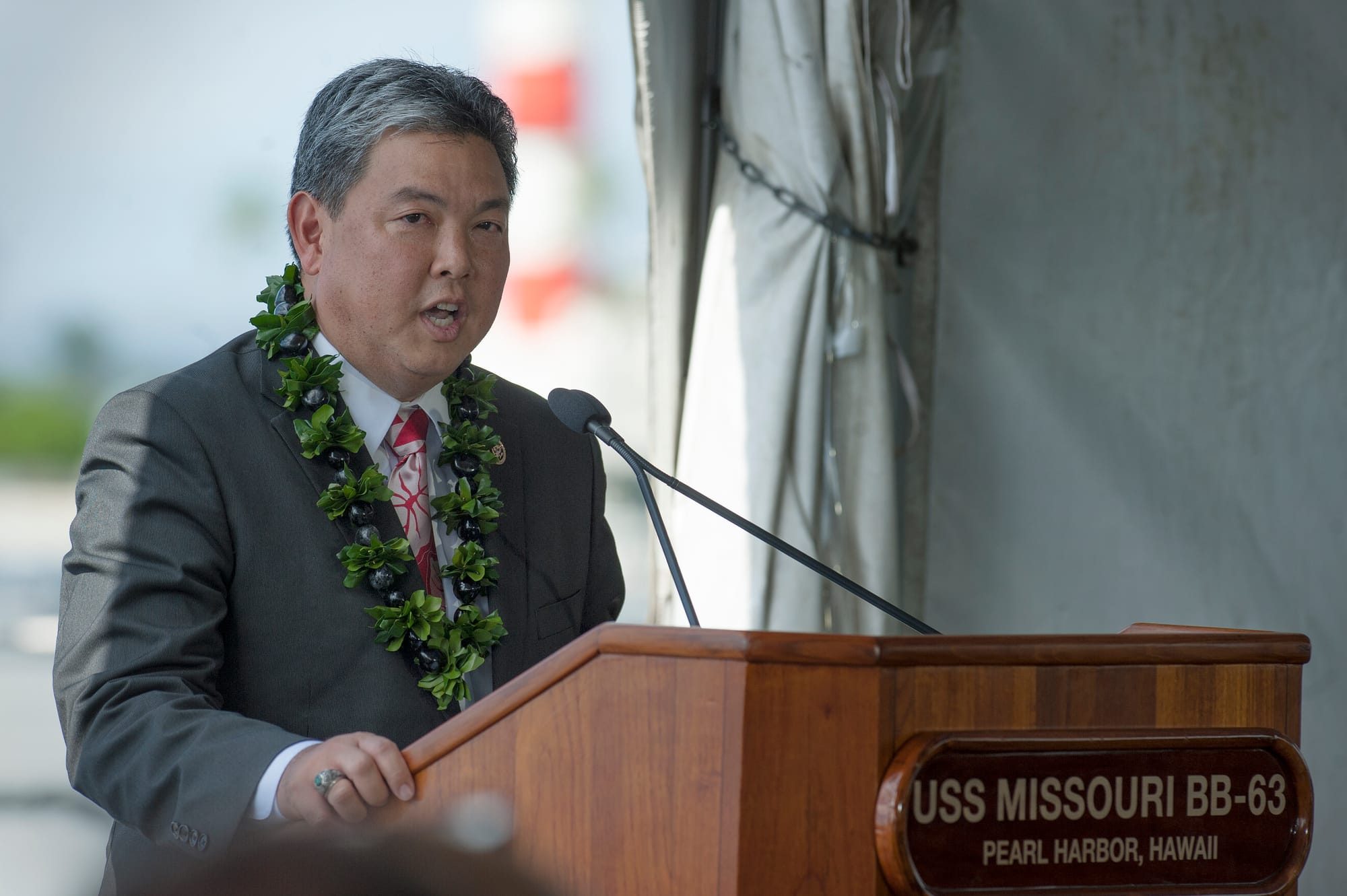 Congressman Mark Takai, U.S. representative for Hawaii, speaks to attendees of the 70th anniversary of the end of World War II ceremony aboard the Battleship Missouri Memorial located on Ford Island, Sept. 2, at Joint Base Pearl Harbor-Hickam, Hawaii. The ceremony honored and recognized sacrifices made by veterans of WWII and recognized the allied partnership between the United States and Japan today. The event began at 9:02 a.m., the exact time Gen. Douglas MacArthur began proceedings for the formal surrender of Imperial Japan 70 years ago. (U.S. Air Force photo by Staff Sgt. Christopher Hubenthal)