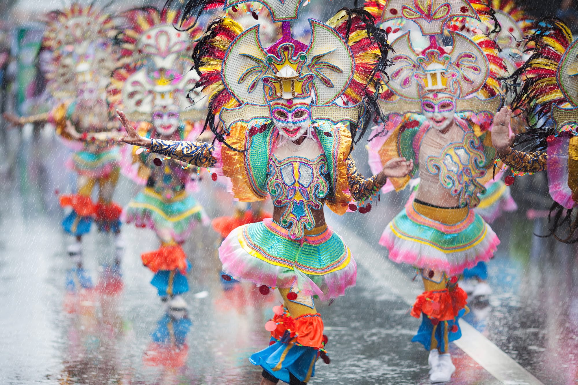 The main feature of the Masskara Festival is the street dancing festivity in which groups of dancers wearing happy masks and colorful costumes dance and gyrate along the city streets to a Latin music beat.