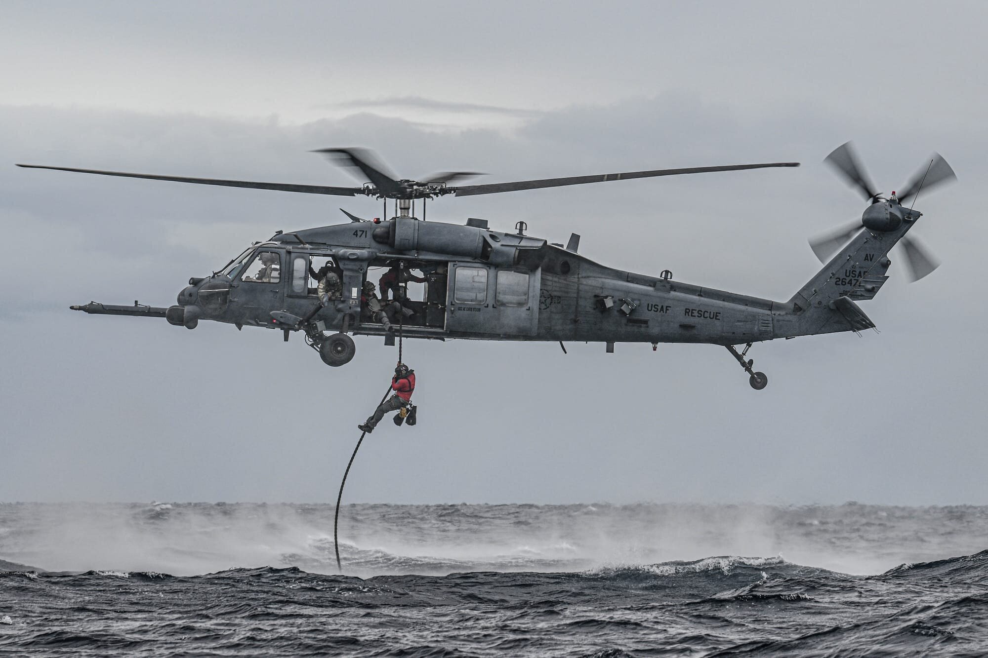 A U.S. Air Force pararescueman, assigned to the 57th Rescue Squadron, fast ropes out of a U.S. Air Force HH-60G Pave Hawk, assigned to the 56th RQS, into the Adriatic Sea during exercise PR ACE Croatia 24 near Pula, Croatia, Sept. 13, 2024. Multinational exercises with allies and partners demonstrate and strengthen a shared commitment towards global security and stability. (U.S. Air Force photo by Airman 1st Class Joseph Bartoszek)