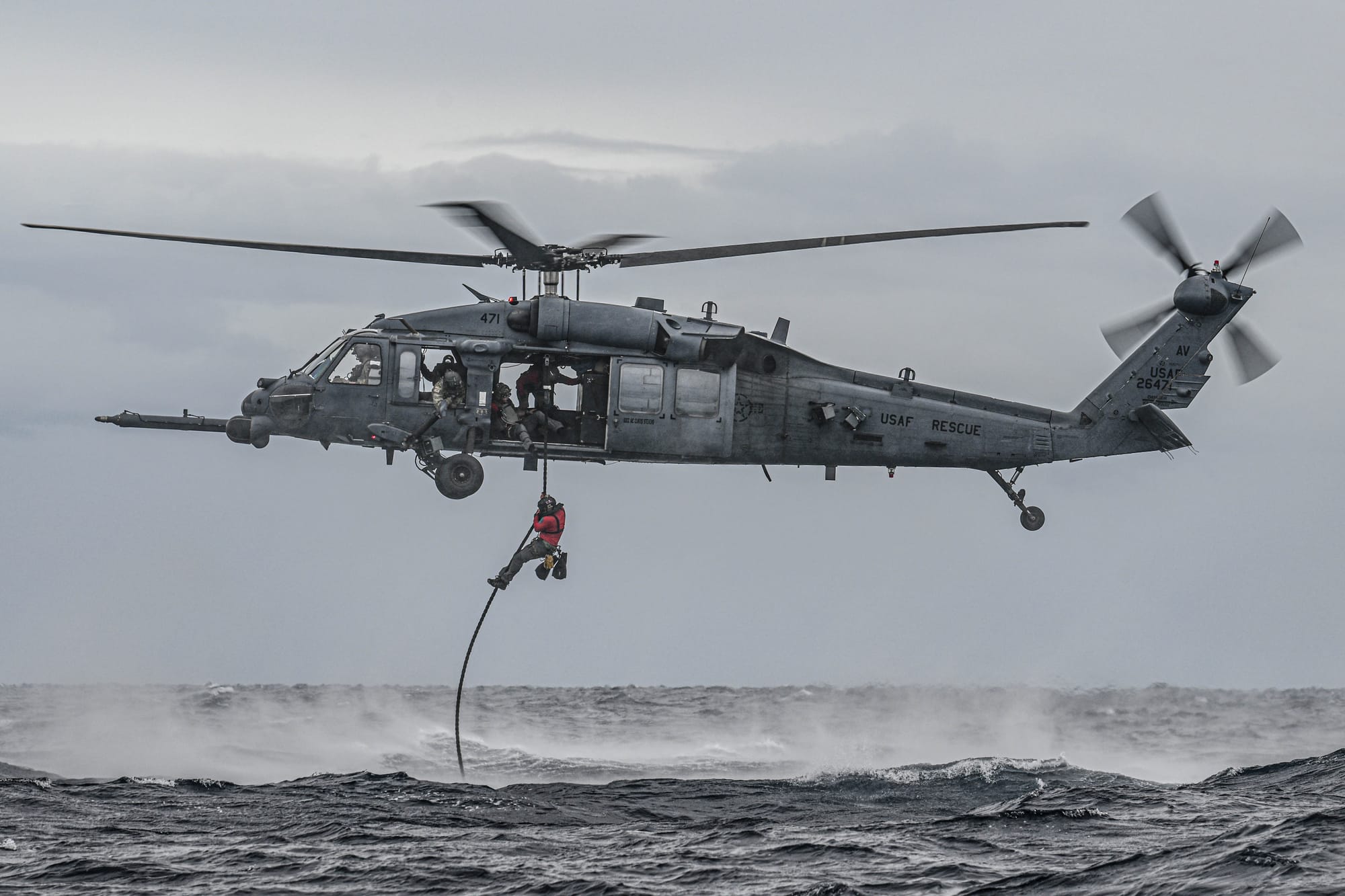 A U.S. Air Force pararescueman, assigned to the 57th Rescue Squadron, fast ropes out of a U.S. Air Force HH-60G Pave Hawk, assigned to the 56th RQS, into the Adriatic Sea during exercise PR ACE Croatia 24 near Pula, Croatia, Sept. 13, 2024. Multinational exercises with allies and partners demonstrate and strengthen a shared commitment towards global security and stability. (U.S. Air Force photo by Airman 1st Class Joseph Bartoszek)