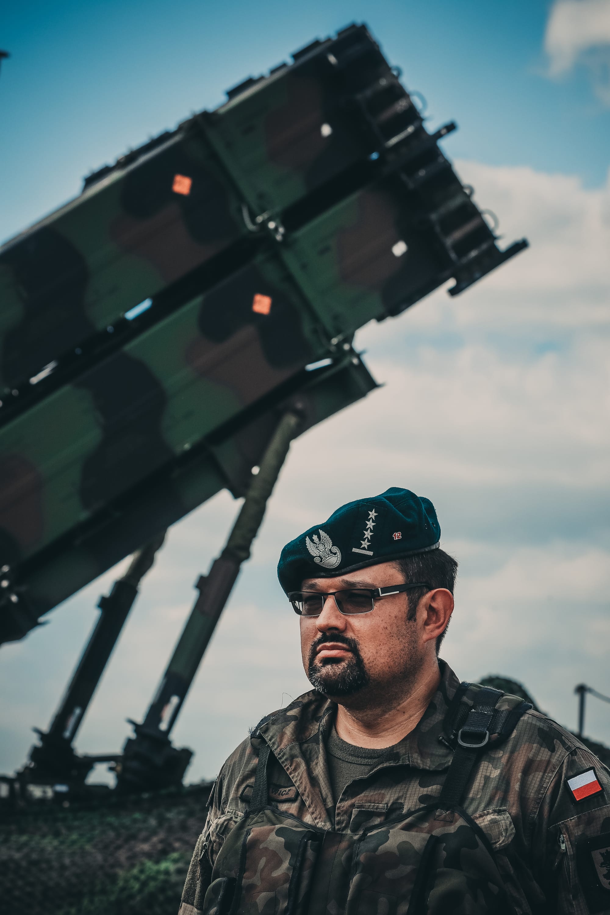 Cpt. Grzegorz Piskiewicz, the air defense officer, 12th Mechanized Division Headquarters, stands for an interview in front of the all-new patriot missile system at Saber Strike 18 near Drawsko Pomorskie, Poland, June 4, 2018. This is the first time a member of the Polish Land Forces has had access to a U.S. missile site. Strengthening our partnerships with our allies from all nations ensures our global defense posture remains reinforced. (Michigan Army National Guard photo by Spc. Aaron Good/Released)