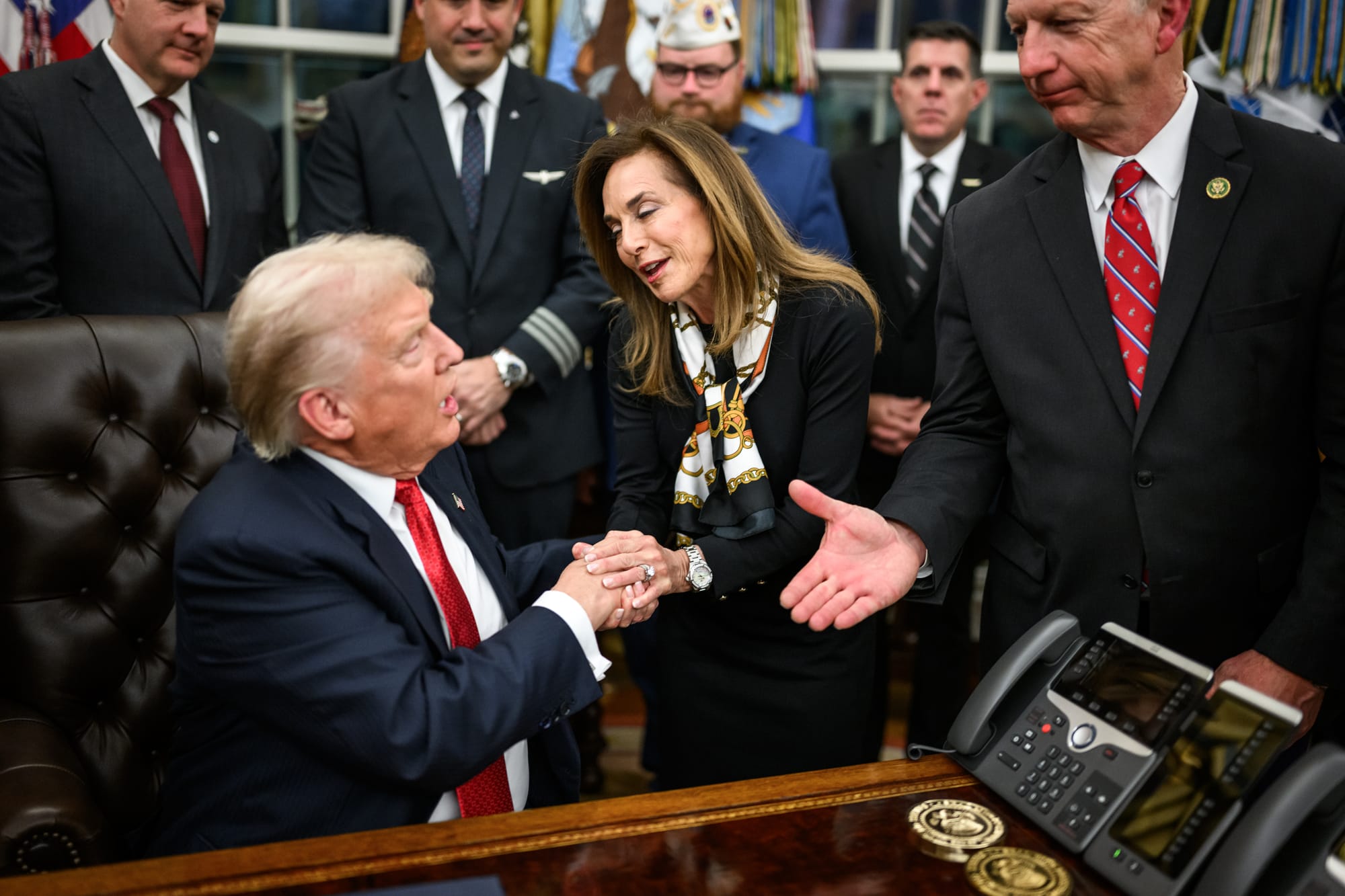 President Donald Trump is congratulated by financial executives and others after signing the funding bill that reopens the government, Wednesday, November 12, 2025, in the Oval Office. (Official White House Photo by Daniel Torok)