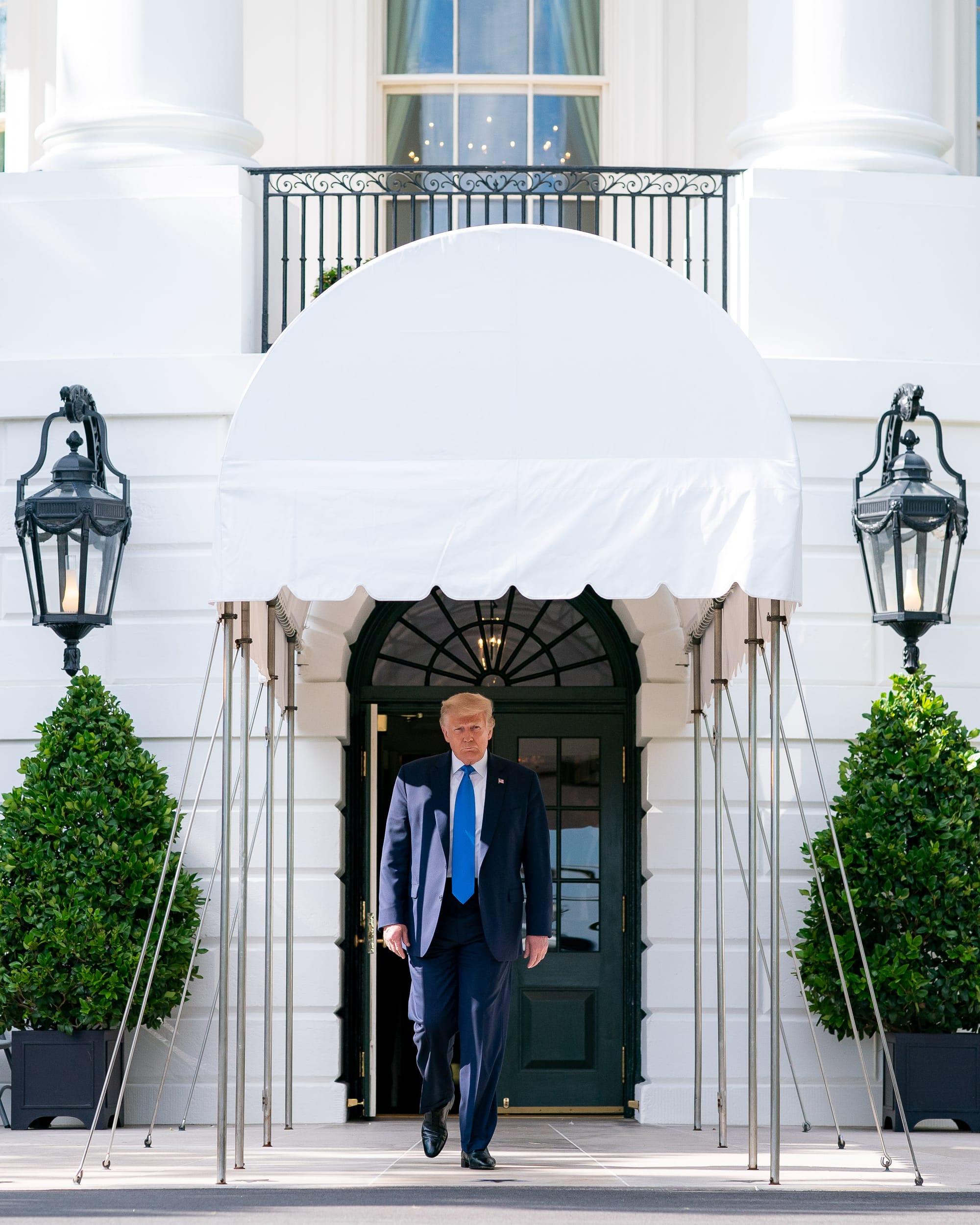 President Donald J. Trump walks from the South Portico of the White House Saturday, July 11, 2020, to board Marine One for his flight to visit wounded warriors, COVID-19 responders and staff at the Walter Reed National Military Medical Center in Bethesda, Md. (Official White House Photo by Tia Dufour)