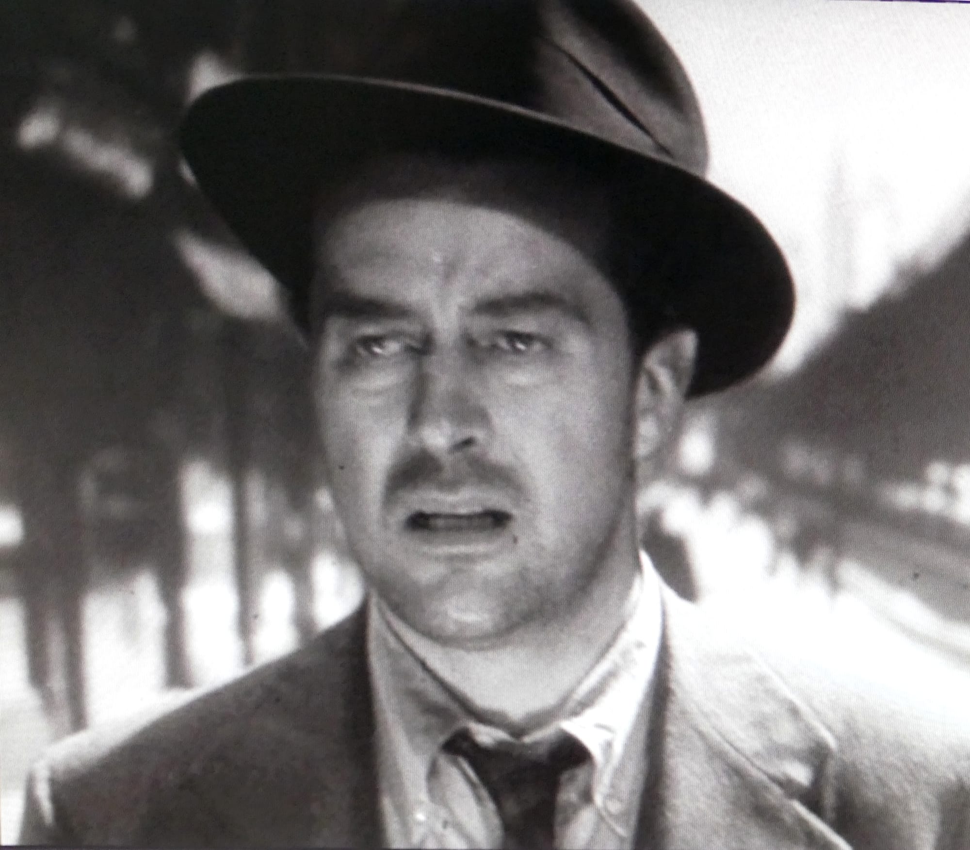 Cropped screenshot with Ray Milland from the trailer for the American film The Lost Weekend (1945) showing Third Avenue El in the background.
