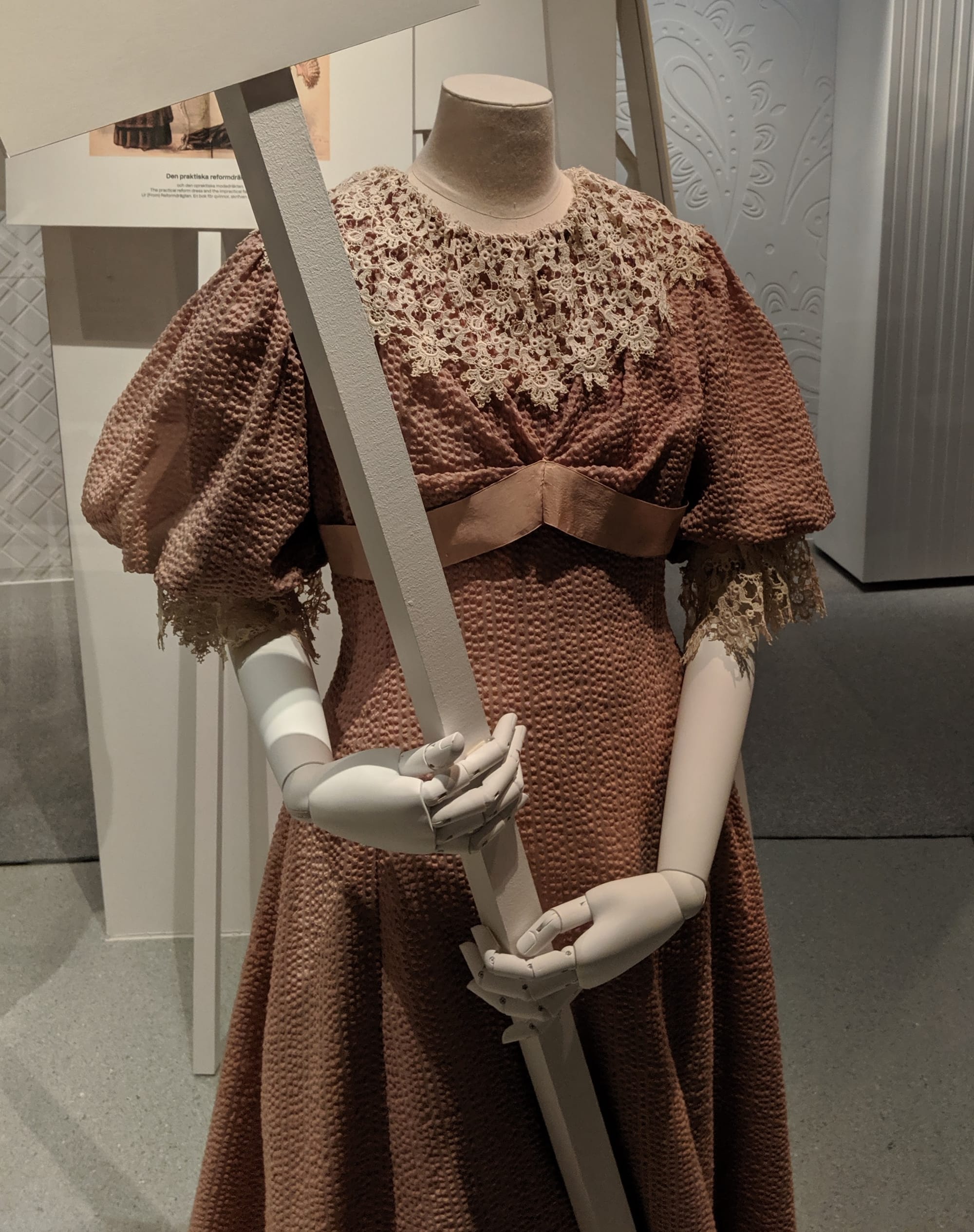 Kristine Dahl was a fashion designer and advocate for dress reform for women in Oslo in the 1890s. She designed this dress with Watteau pleats and Greek breast band for Swedish  feminist Gurli Linder to be worn without a corset or bustle as part of a new aesthetic of freer, more healthy clothes.