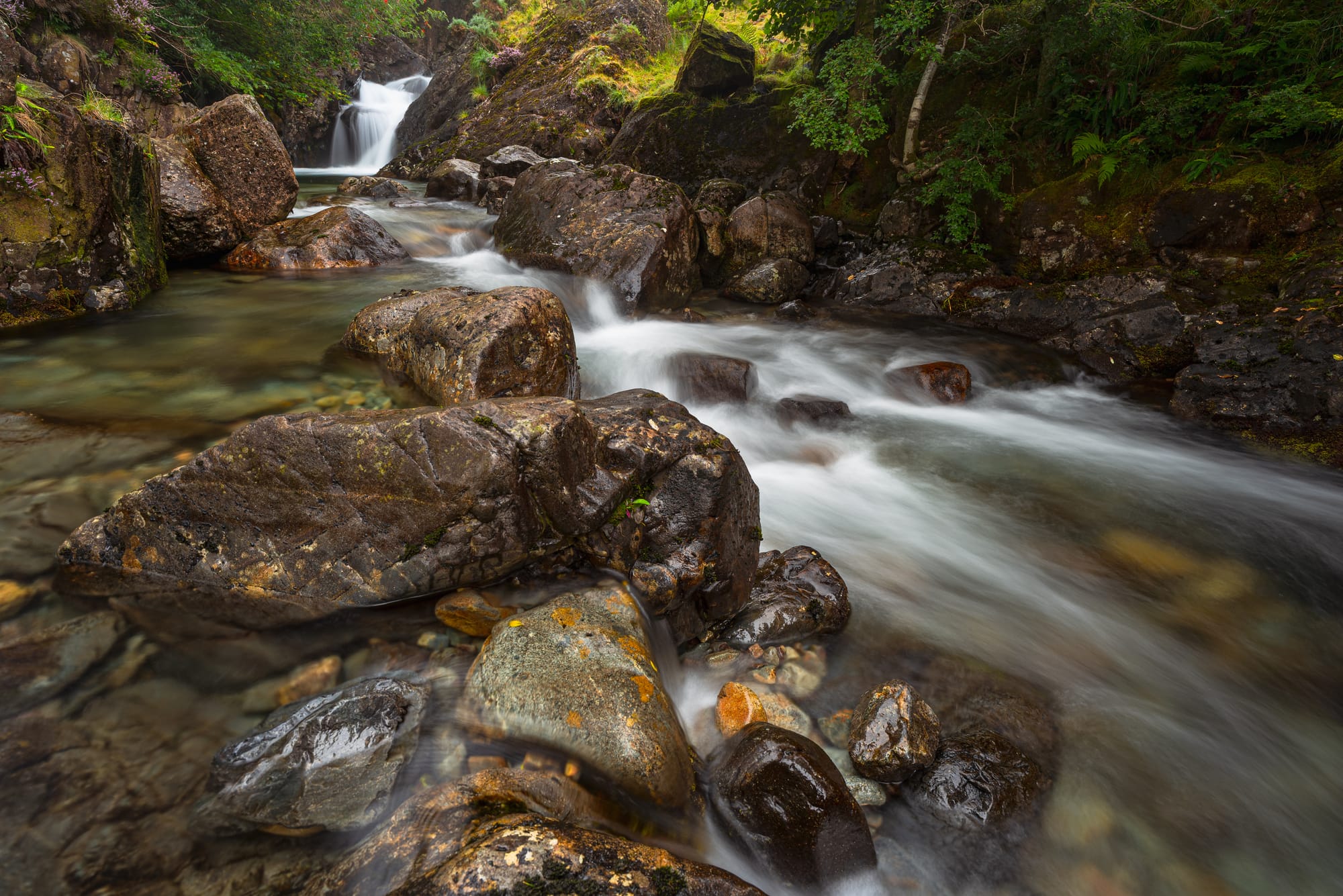 Long exposure photograph of the Ritson's Force waterfalls in the valley of Mosedale, Lake District, England, United Kingdom.
