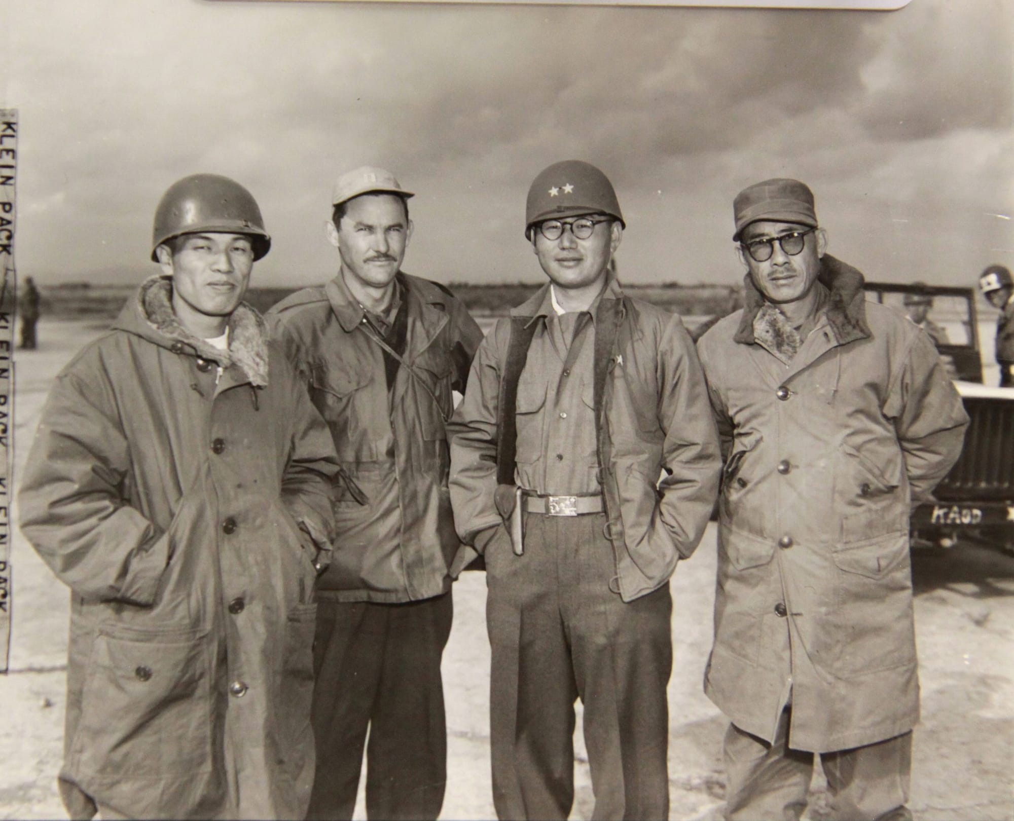 "CONFLICT IN KOREA: L-R: Brig Gen Lee Chongchan, 3rd ROK Div; Capt. Claude Short (Bessemer City, N.C.); Maj Gen Kim Paikil, CG of 1st ROK Div; and Brig Gen Lee Chunsik, Vice Commander, 1st ROK Div, waiting for the arrival of Gen Almond at Hamhung, Korea."
NARA / Courtesy of the National Institute of Korea History.

Uploader's note:
BG Lee Jongchan (이종찬, 1916-1983) - Imperial Japanese Army officer (Major), 1937-1945; CO, ROK Capital Division, 1950; CG, ROK 3rd Division, 1950; Army Chief of Staff, 1951-52; Superintendent, ROK Army College, 1953-60; retired as LTG, 1960. Minister of National Defense, 1960; Ambassador to Italy, 1961-67; member of the National Assembly, 1973-80.
MG Kim Baek-il (김백일, 1917-1951) - Imperial Manchukuo Army officer (Captain), 1937-1945; Army Deputy Chief of Staff, 1950; CG, ROK I Corps, 1950-51; died in air crash on 28 March 1951.

BG Lee Junsik (이준식, 1900-1966) - Chinese Nationalist Army officer (Colonel), 1930-39; Korean Liberation Army officer (Colonel), 1950-46; superintendent, Korean Military Academy, 1950; CG, ROK 3rd Division, 1950; Deputy CG, ROK I Corps, 1950; G-3, ROKA HQ, 1951-52; retired as LTG, 1959.