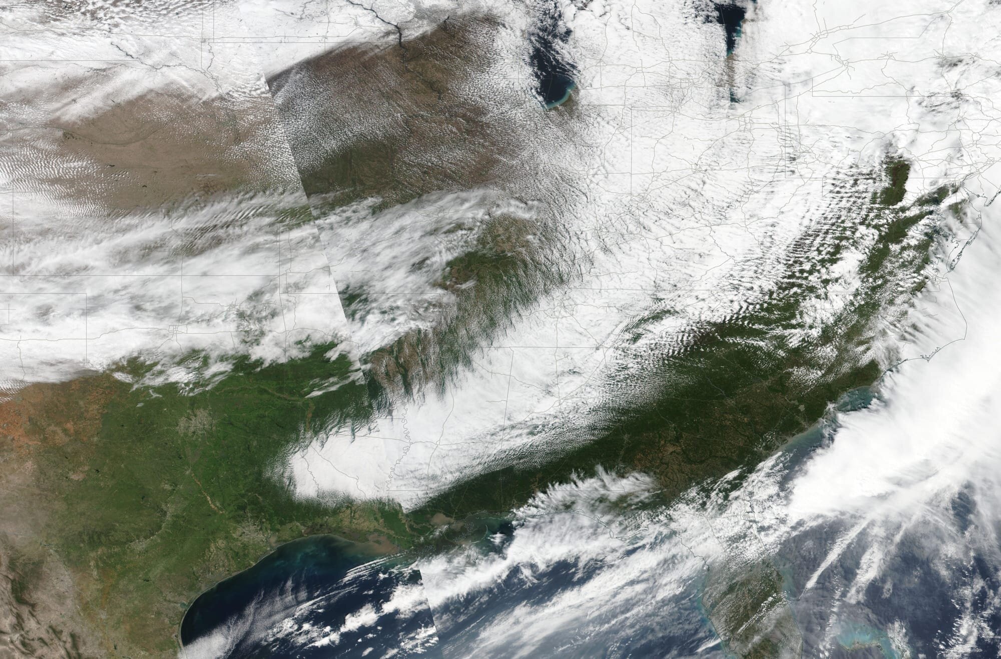 Satellite image from NASA EOSDIS Worldview showing the 2020 Easter Outbreak, visible is the squall line and supercells.