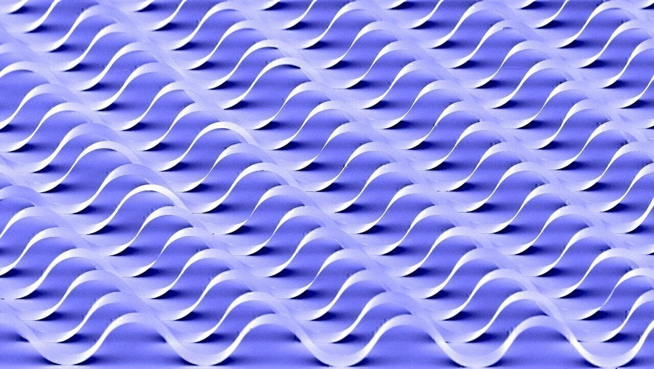 Semiconductor ribbons with buckled profiles on polydimethysiloxane surfaces that are functionalized for surface chemical bonding exhibit mechanical stretchability.
Flexible electronic structures with the potential bend, expand and manipulate electronic devices are being developed by researchers at Argonne National Laboratory and the University of Illinois at Urbana-Champaign. The flexible structure could find useful applications as sensors and as electronic devices that can be integrated into artificial muscles or biological tissues. The objective to generate a concept along with subsequent technology that would allow for electronic wires and circuits to stretch like rubbers and accordions leading to sensor-embedded covers for aircraft and robots, and prosthetic skin for human. Presently they are developing stretchable electronic stretchable electronic sensors for smart surgical gloves and hemispherical electronic eye images