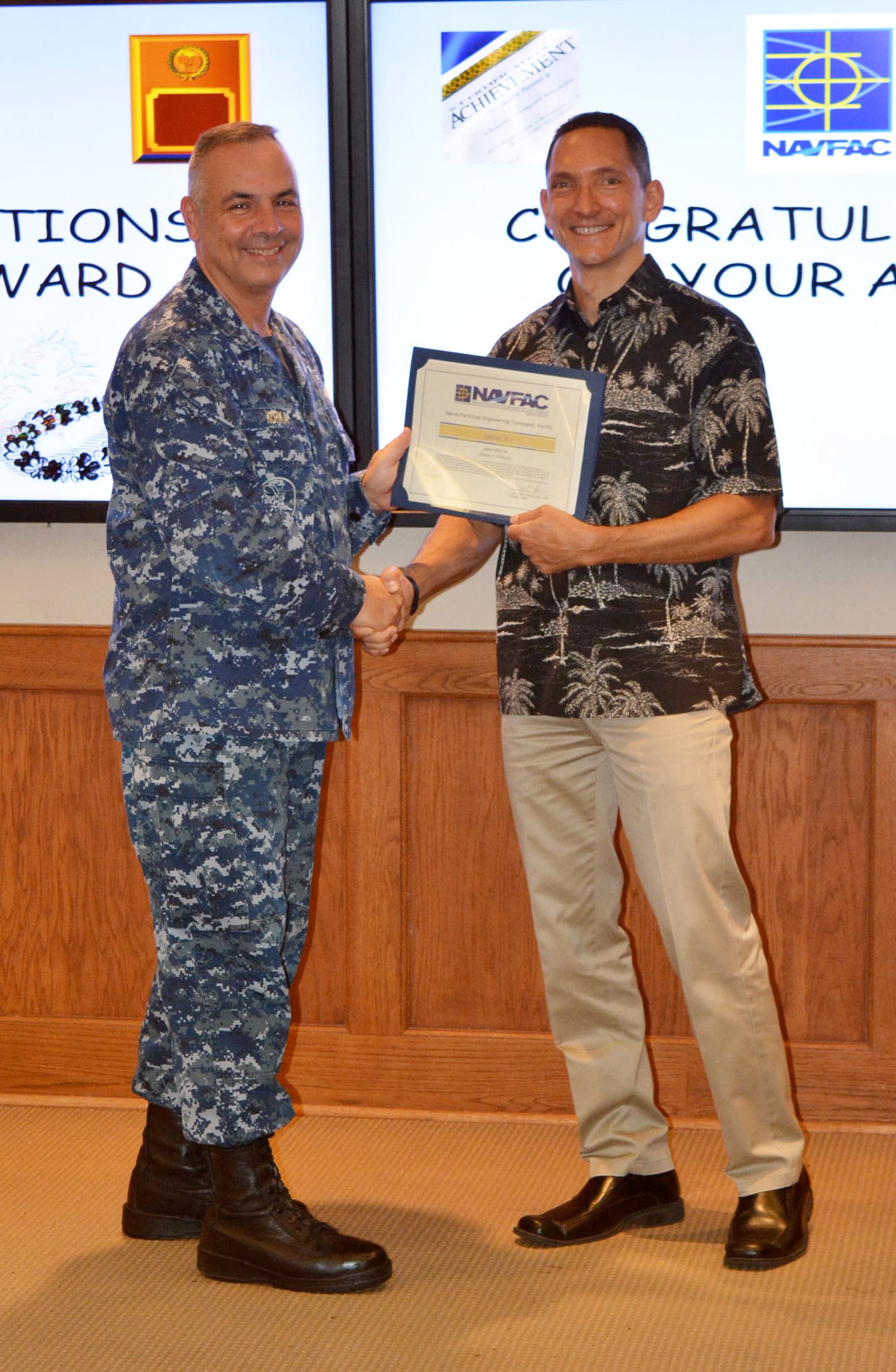 PEARL HARBOR – HICKAM – Naval Facilities Engineering Command (NAVFAC) Pacific Command Information Officer Ayman S. El-Swaify (right) is awarded the Special Act Award May 24. NAVFAC Pacific Commander Rear Adm. John W. Korka presented him this award to recognize his contributions to the command while El-Swaify served as the Acting Business Director from November 2015 to March 2016.
U.S. Navy photo by Tom Clements