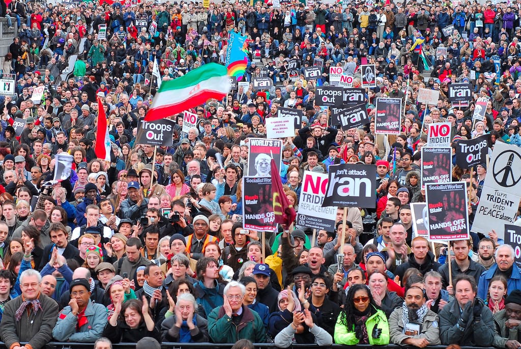Stop The War protests in London, 24 Feb 2007. Scenes Trafalgar Square - 60,000 protestors. Banners for various organisations are visible, including Socialist Worker, CND, Stop the War Coalition, and Quakers.
