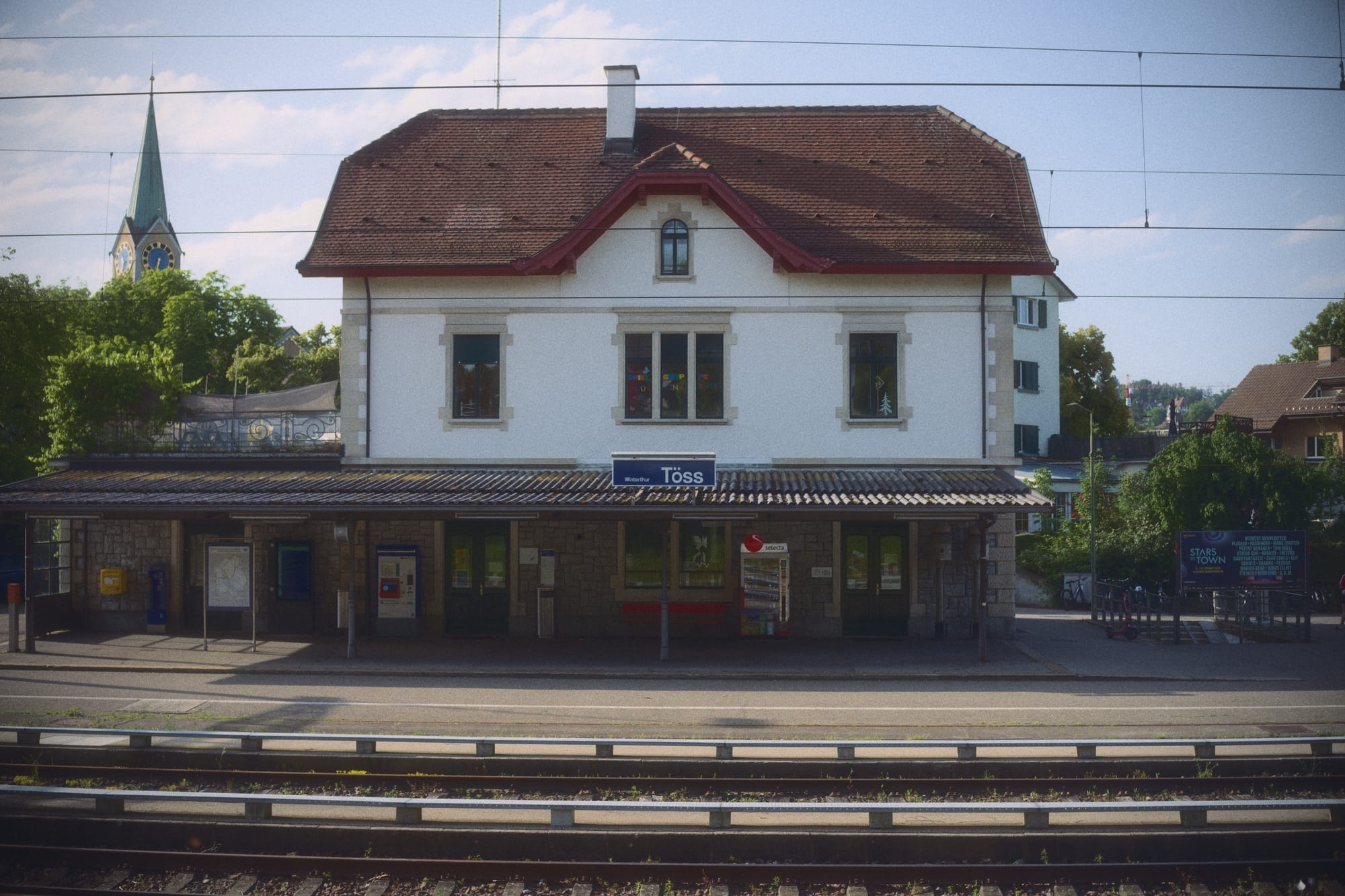 View of the winterthur töss train station including tracks