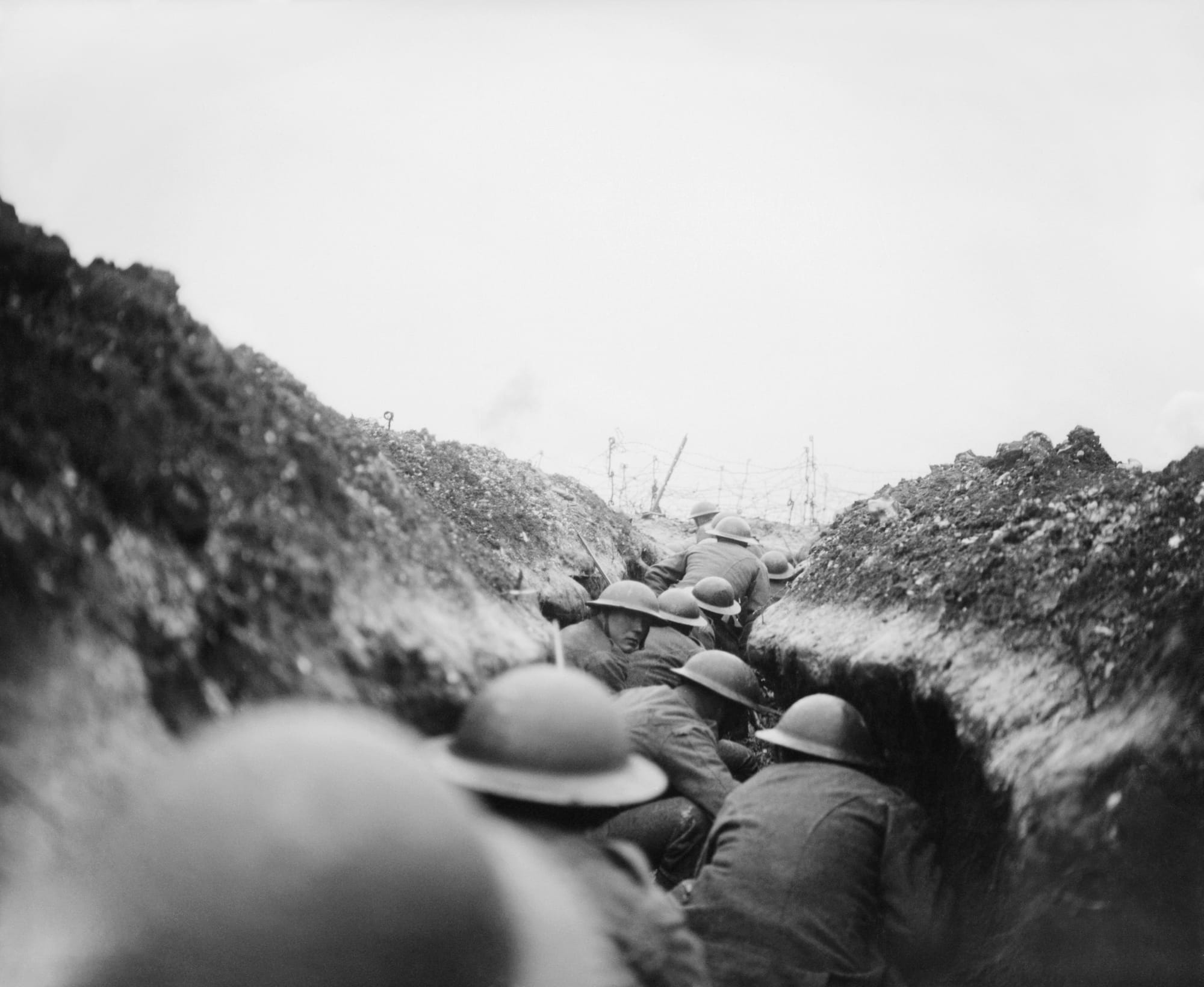 The German Withdrawal To the Hindenburg Line, March-april 1917
A raiding party of the 10th Battalion, Cameronians (Scottish Rifles) waiting in nap for the signal to go. John Warwick Brooke, the official photographer, followed them in the sap, into which a shell fell short killing seven men. Near Arras, 24 March 1917.