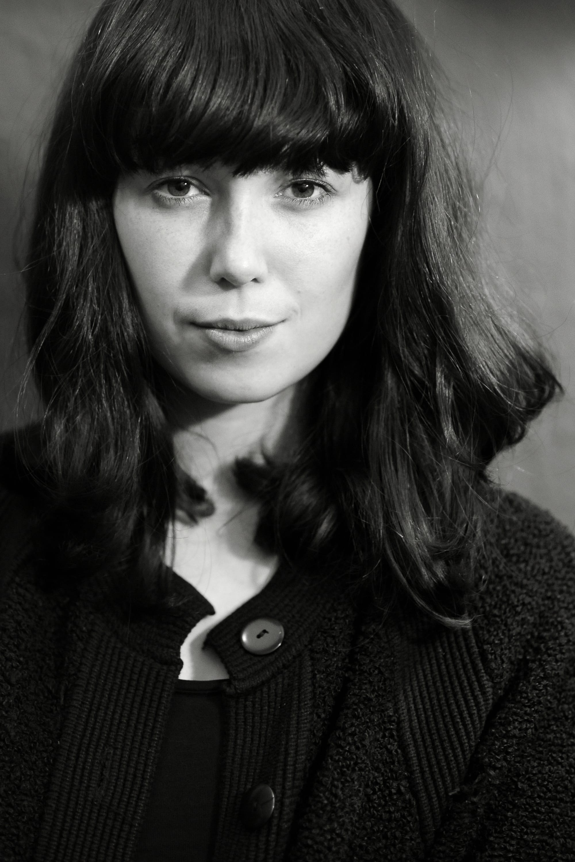 The History of Apple Pie - A black and white portrait photo of artist Kelly Lee Owens in 2013. Owens previously played bass in the indie band 'The History of Apple Pie'.