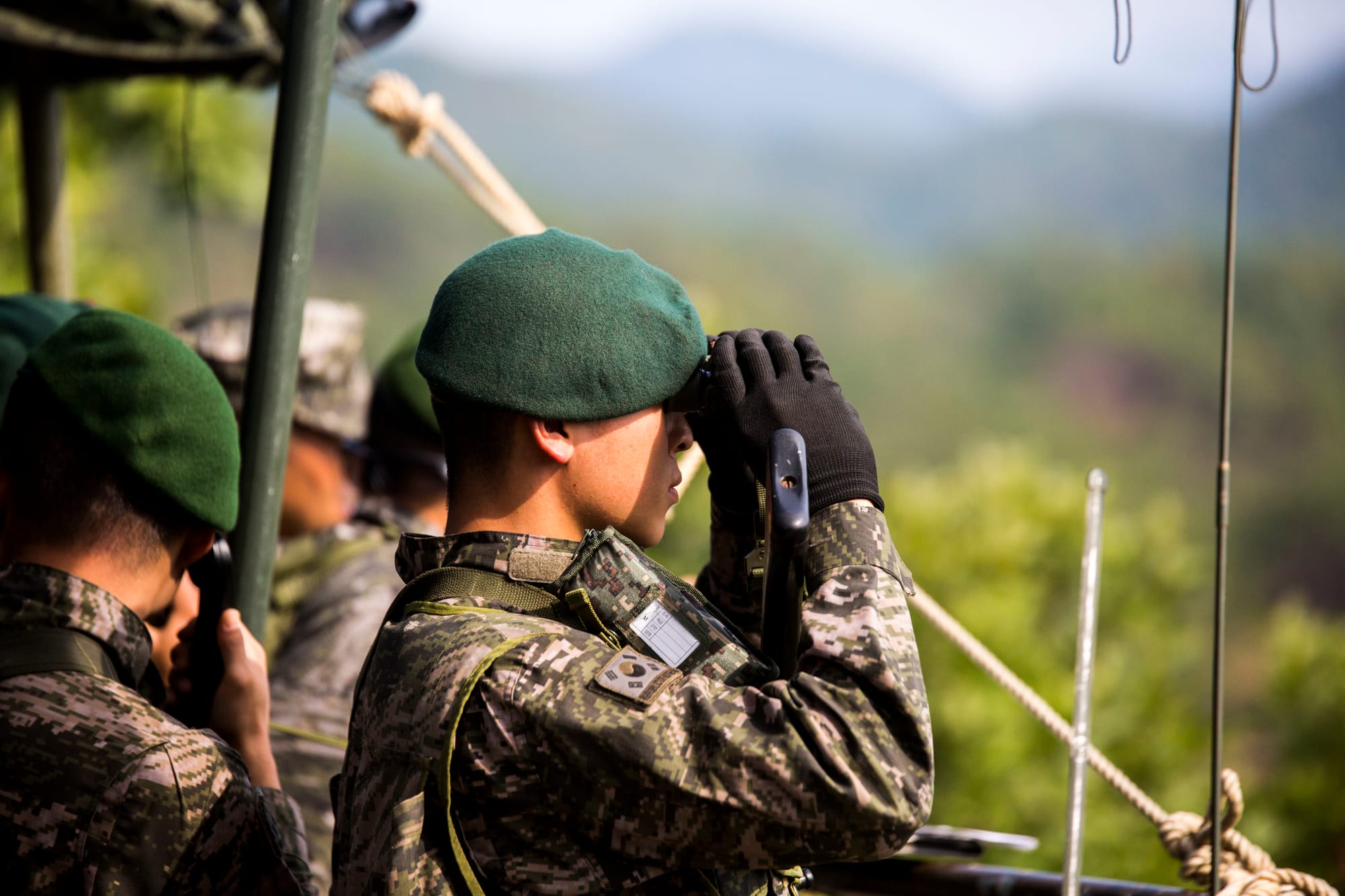 Republic of Korea Marine Staff Sgt. Yeongho Kim observes the M48A3K Main Battle Tanks as they fire on simulated enemies during Korean Marine Exchange Program 15-12, at Rodriguez Live-Fire Range, Republic of Korea, Sept. 17, 2015. The tanks were part of a plan to suppress enemy positions in order to allow U.S. Marine infantry units to move forward. KMEP 15-12 is a bilateral training exercise that enhances the ROK and U.S. alliance, promotes stability on the Korean Peninsula and strengthens ROK and U.S. military capabilities. The tanks are with 2nd Tank Battalion, 2nd Marine Division, ROK Headquarters Marine Corps. Kim, from Gwangju, ROK, is a forward observer with 2nd Tank Battalion, 2nd Marine Division. The U.S. Marines are with Fox Company, 2nd Battalion, 3rd Marine Regiment, currently assigned to 4th Marine Regiment, 3rd Marine Division, III Marine Expeditionary Force under the unit deployment program. (U.S. Marine Corps photo by Cpl. Tyler S. Giguere/ Released)
Unit: III Marine Expeditionary Force / Marine Corps Installations Pacific