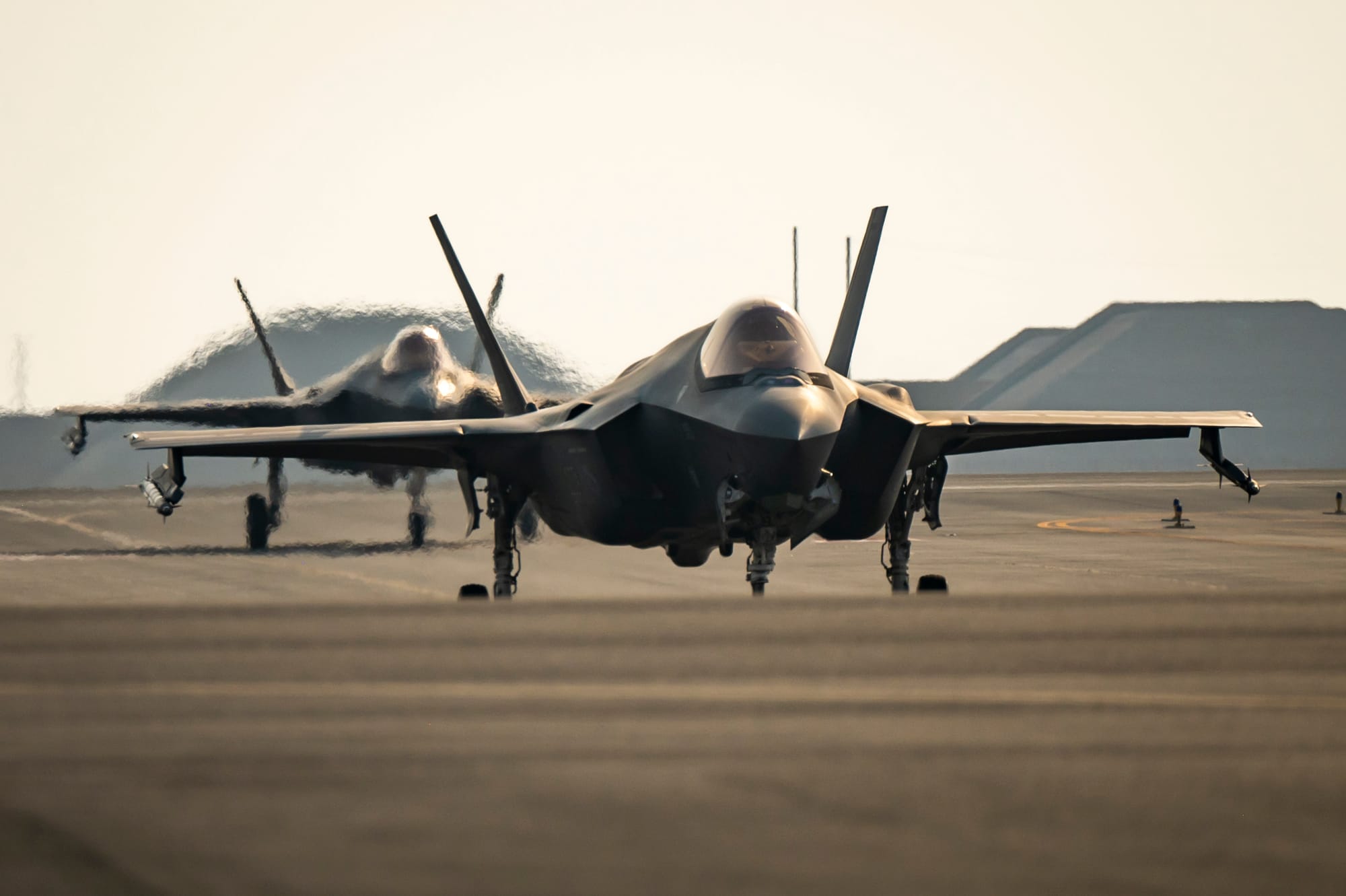 Two U.S. Air Force F-35A Lightning IIs from the 421st Expeditionary Fighter Squadron taxi on the runway at Al Udeid Air Base, Qatar, Sept. 5, 2023. In coordination with regional allies, partners and the U.S. Navy, the F-35s partnered with A-10 Thunderbolts and F-16 Fighting Falcons in the U.S. Central Command theater to monitor the Strait of Hormuz. (U.S. Air Force photo by Tech. Sgt. Leah Ferrante)