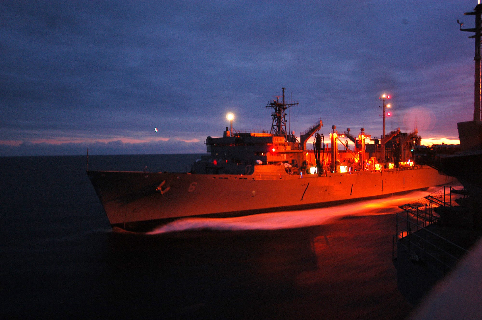 Atlantic Ocean (Nov. 11, 2003) -- The Military Sealift Command ship USNS Supply (T-AOE 6) steams along side the nuclear powered aircraft carrier USS George Washington (CVN 73) for an ammunition transfer.  The Norfolk, Va.-based carrier is conducting Composite Training Unit Exercise (COMPTUEX) in the Atlantic Ocean.  U.S. Navy photo by Photographer's Mate Airman Joan Kretschmer. (RELEASED)