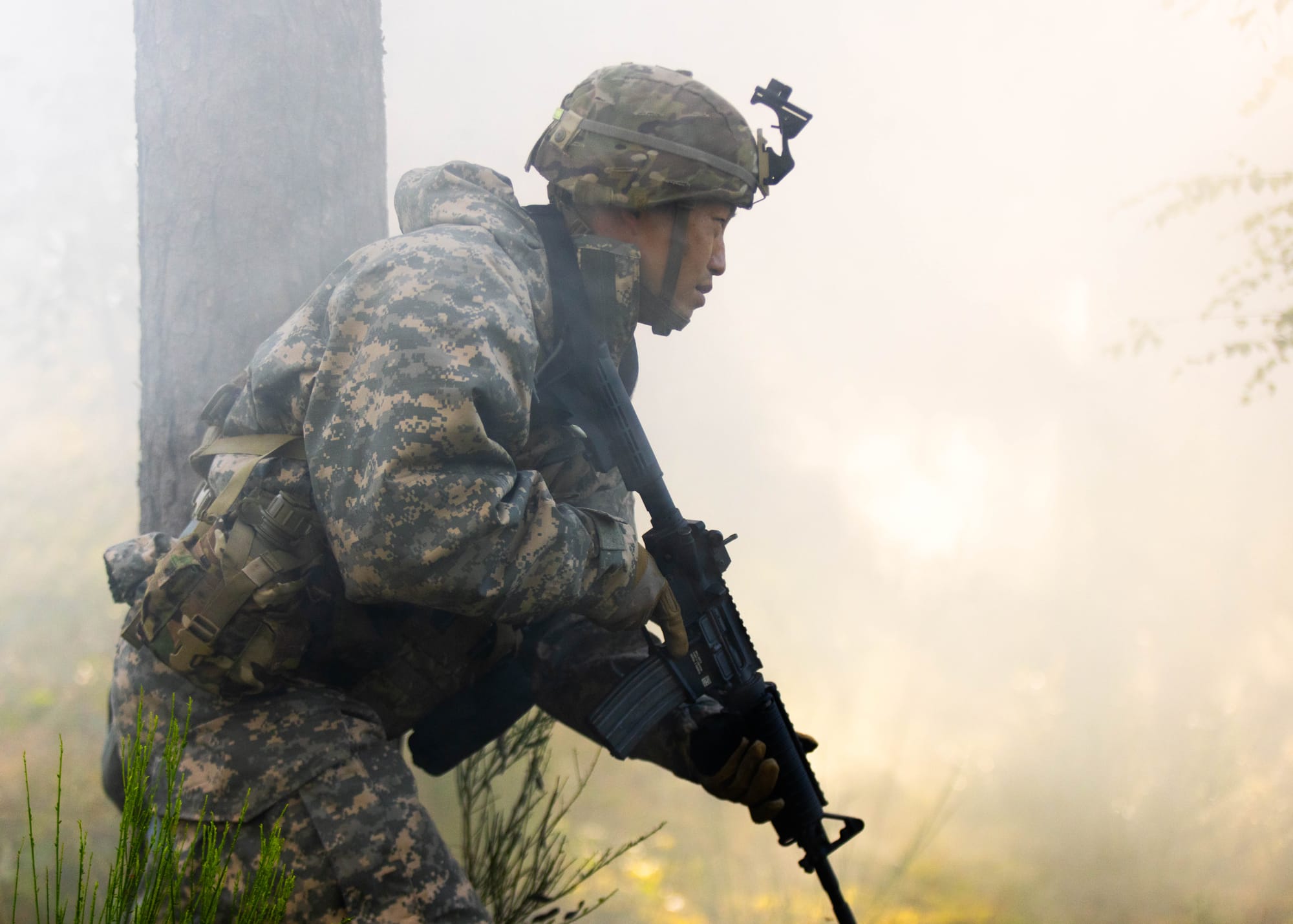 U.S. Army Sgt. 1st Class Youngkook Matsunaga, assigned to the 2d Theater Signal Brigade, runs on a chemical, biological, radiological, and nuclear (CBRN) lane during the U.S. Army Europe and Africa (USAREUR-AF) Best Squad Competition at Grafenwoehr Training Area, Germany, Aug. 6, 2024. Soldiers from across USAREUR-AF will compete in the year's Best Squad Competition in Grafenwoehr, Germany, July 31 - Aug. 9, 2024. Teams representing units from across USAREUR-AF will test their tactical proficiency, communication, and overall cohesion as they compete for the title of Best Squad. Winners of this competition will advance to compete at the U.S. Army Best Squad Competition. (U.S. Army photo by Sgt. Gianna Elle Sulger)
