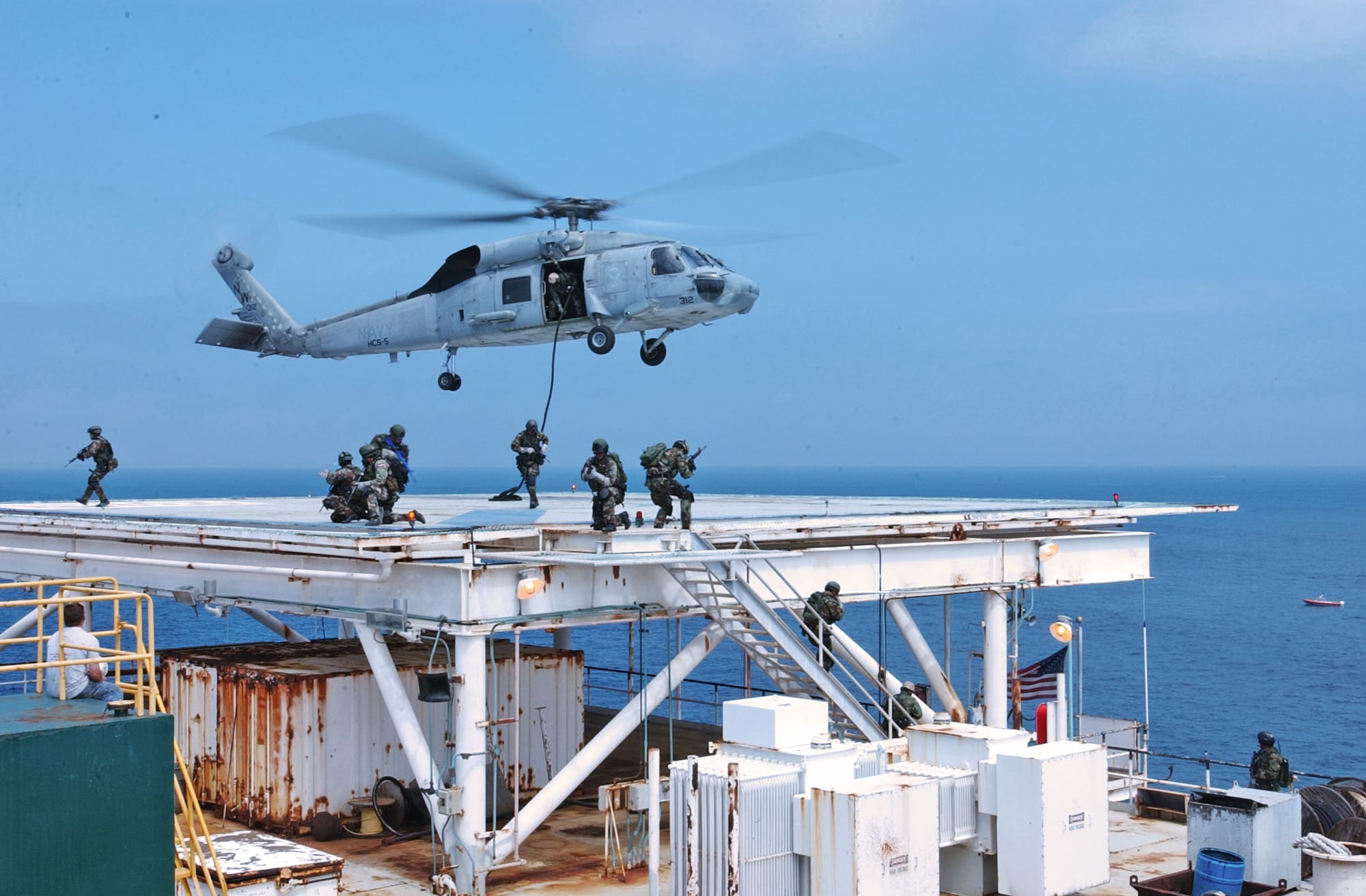 Remote Training Facility (March 31, 2004) – Navy SEAL (SEa Air Land) operators practice on domestic Gas and Oil Platforms (GOPLAT) to prepare for future attacks on world oil production facilities..Navy SEALs are maritime special operations forces who strike from the SEa, Air and Land.  They operate in small numbers, infiltrating their objective areas by fixed-wing aircraft, helicopters, Navy surface ships, combatant craft and various underwater crafts.  SEALs have the ability to conduct a variety of high-risk missions- unconventional warfare, direct action, intelligence gathering, special reconnaissance, combat search and rescue, diversionary attacks and precision strikes- all in a clandestine fashion.  .Official U.S. Navy photo by Photographer's Mate 2nd Class Eric S. Logsdon, Naval Special Warfare Command Public Affairs Office.  (RELEASED LT Martin Clark, Assistant Public Affairs Officer Naval Special Warfare Command.)