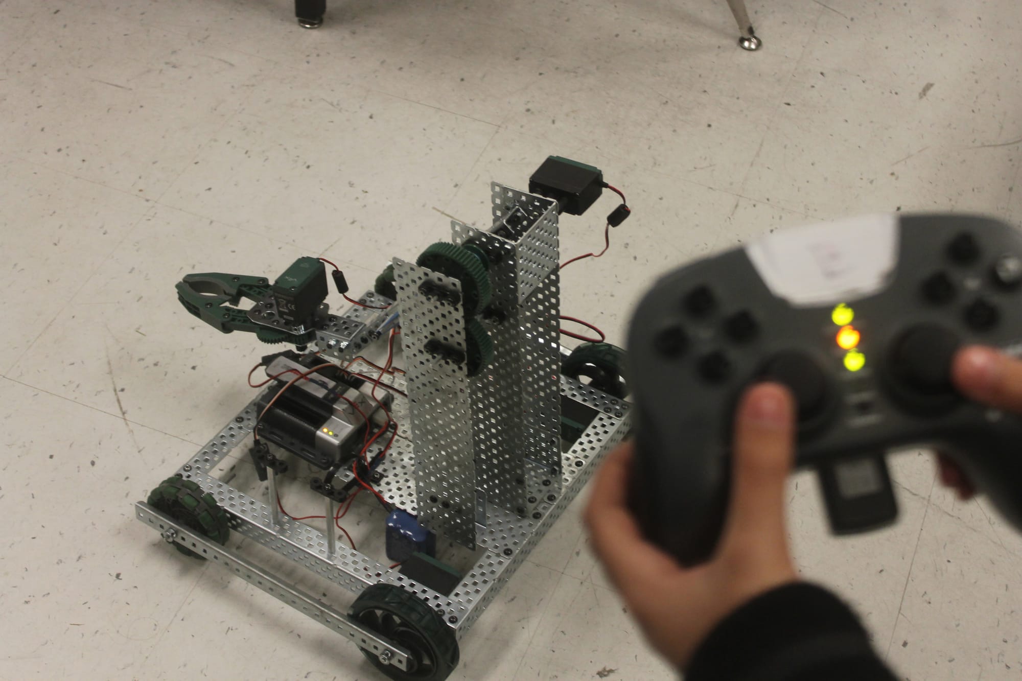 A robot built by students at Robert O. Gibson Middle School for the 2017-2018 VEX Robotics Competition season. Here it is seen being controlled with remote control.
