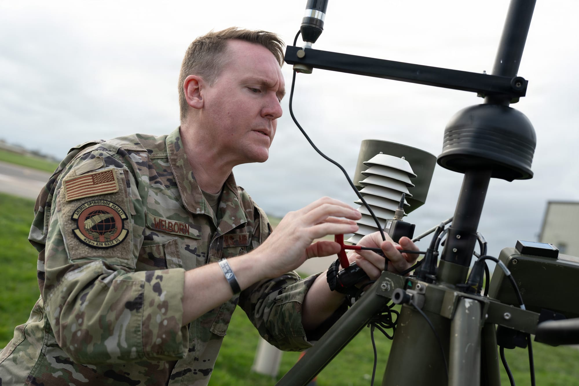 U.S. Air Force Master Sgt. Robert Welborn, 420th Air Base Squadron Flight Chief of Weather Operations, adjusts sensors on the Tactical Meteorological Observing System (TMOS) at RAF Fairford, England, Nov. 4, 2025. The TMOS enables the Weather Flight to maintain accurate reporting on wind, temperature, visibility and cloud height for aircraft operations. (U.S. Air Force photo by Airman 1st Class Adam Enbal)
