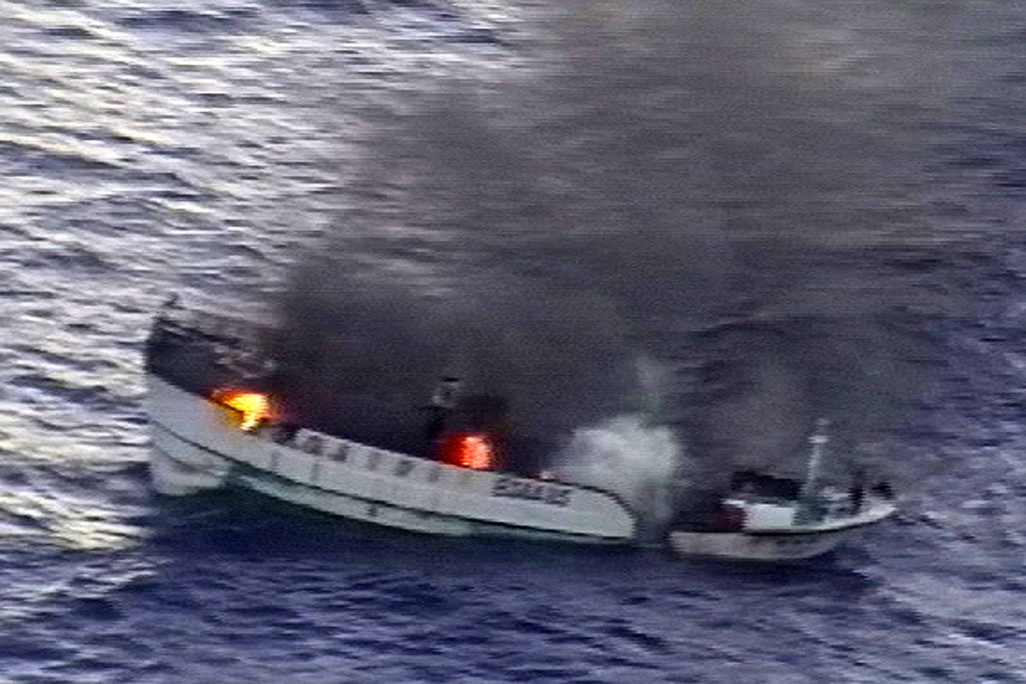 PACIFIC OCEAN (April 21, 2012) A fire burns aboard the Taiwanese fishing vessel Shin Maan Chun in the Pacific Ocean. The fire forced the crew of nine to abandon ship and through a coordinated effort between the U.S. 7th Fleet and U.S. Coast Guard Sector Guam, all of the fishermen were safely rescued and brought aboard the Marshallese-flagged bulk carrier Semirio. (U.S. Navy photo/Released)