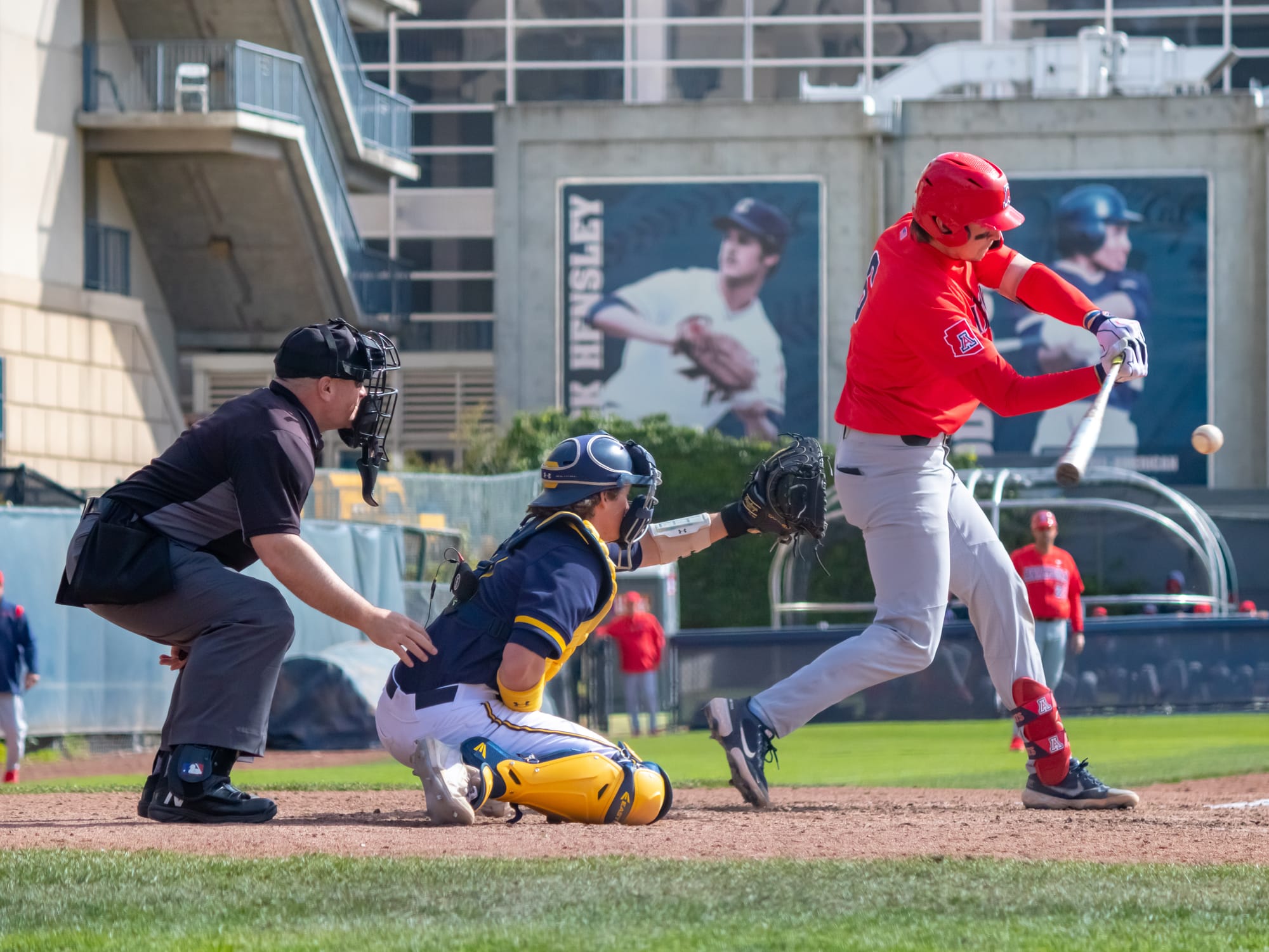 Daniel Susac, #6 Arizona, during an at bat in Arizona's 13-5 victory over California, March 13, 2022. Cole Elvis, #6 California, catching; Mike Fichter umpiring.